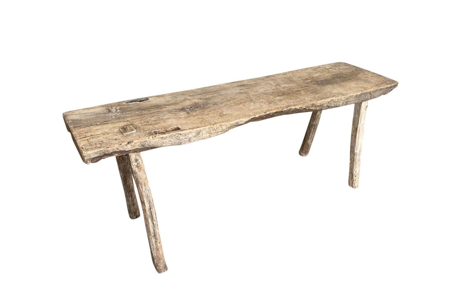 A terrific early 19th century rustic bench from the Catalan region of Spain. Soundly constructed from naturally washed chestnut. Super patina. Wonderful not only as a bench, but as a coffee table as well.