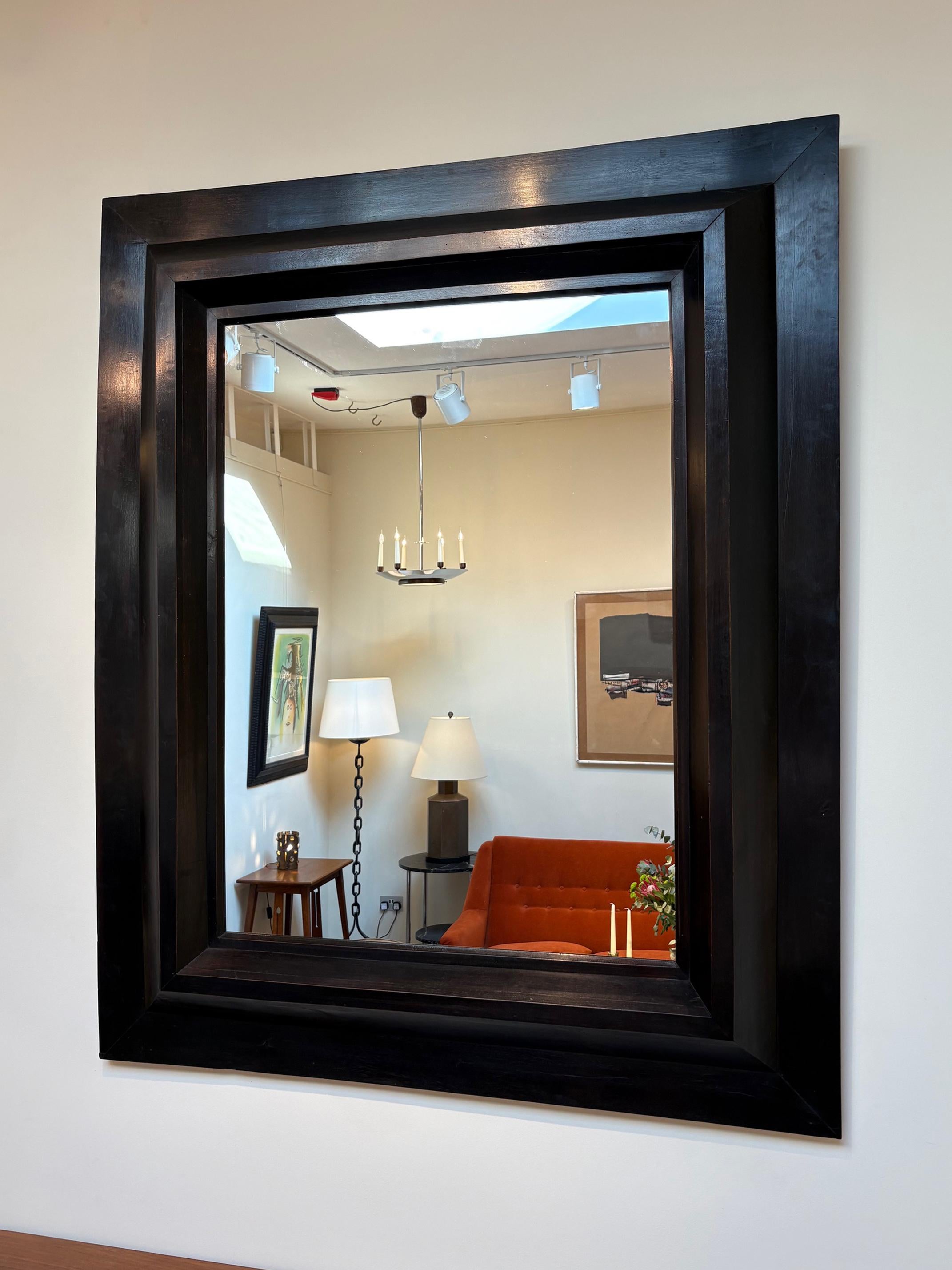 A large ebonised geometric frame mirror
Spain, mid 20th Century
