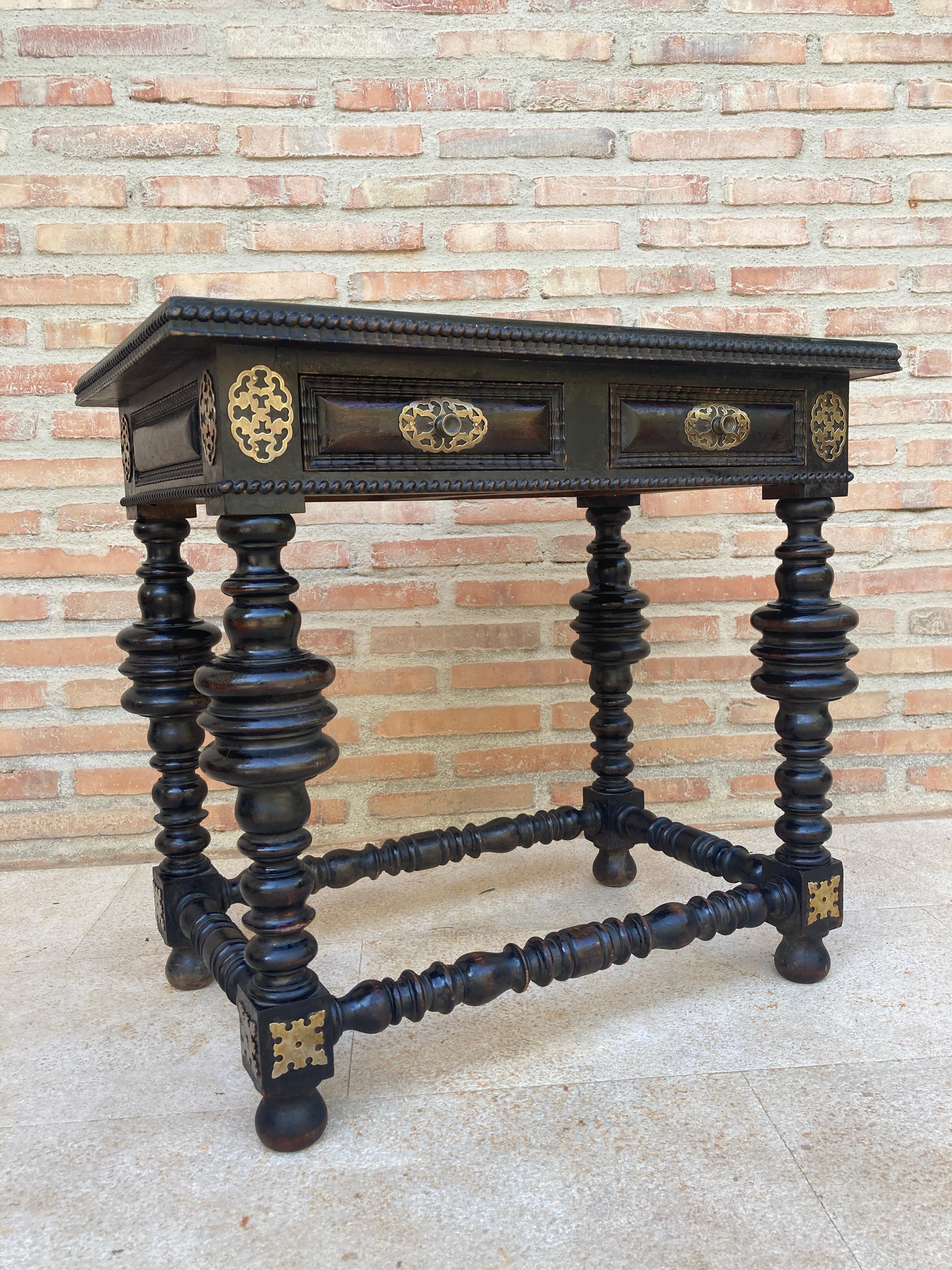 Walnut ebonized side table with single drawer, Spanish 1880s.
A Spanish walnut side table with single drawer, scalloped apron, turned legs and iron side stretcher from the late 19th century. This elegant Spanish table features a simple, rectangular