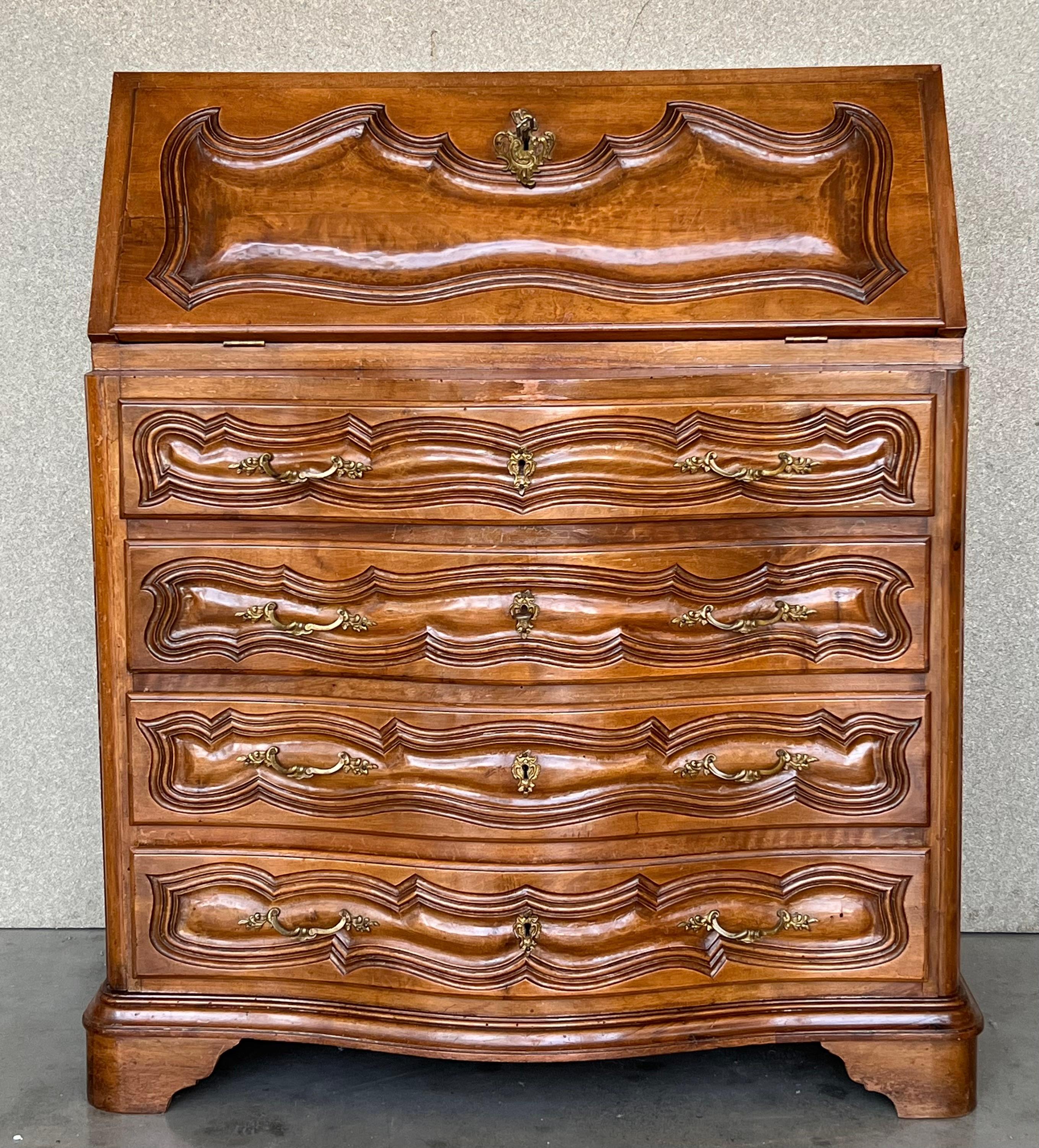 Mid 20th century walnut Spanish fall-front secretary with molded carvings in drawers and doors.


Measures: Total deep when the leaf is open : 27.55in
Height from the floor to the open leaf: 29.52in.
