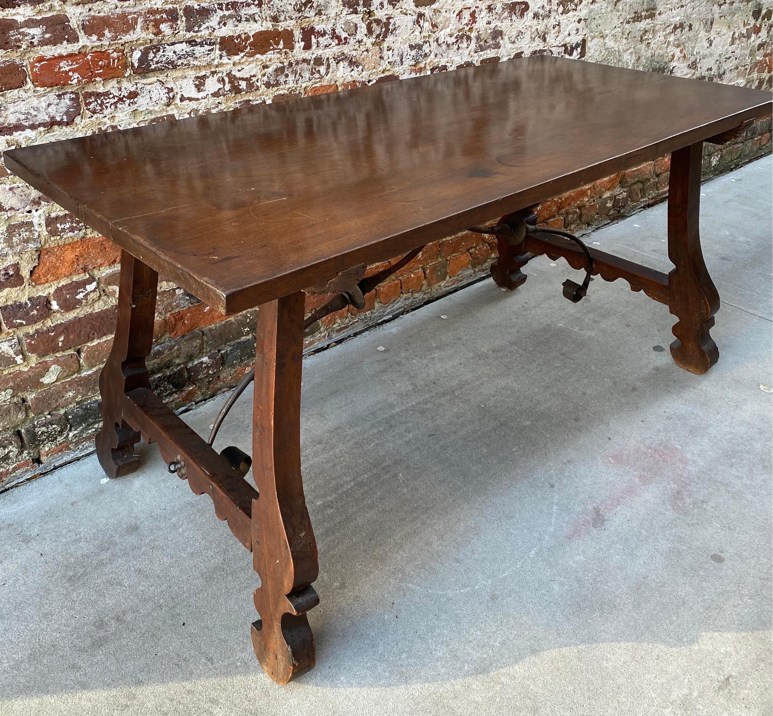 Spanish farm table with iron accents at base. Great for use as table or desk.