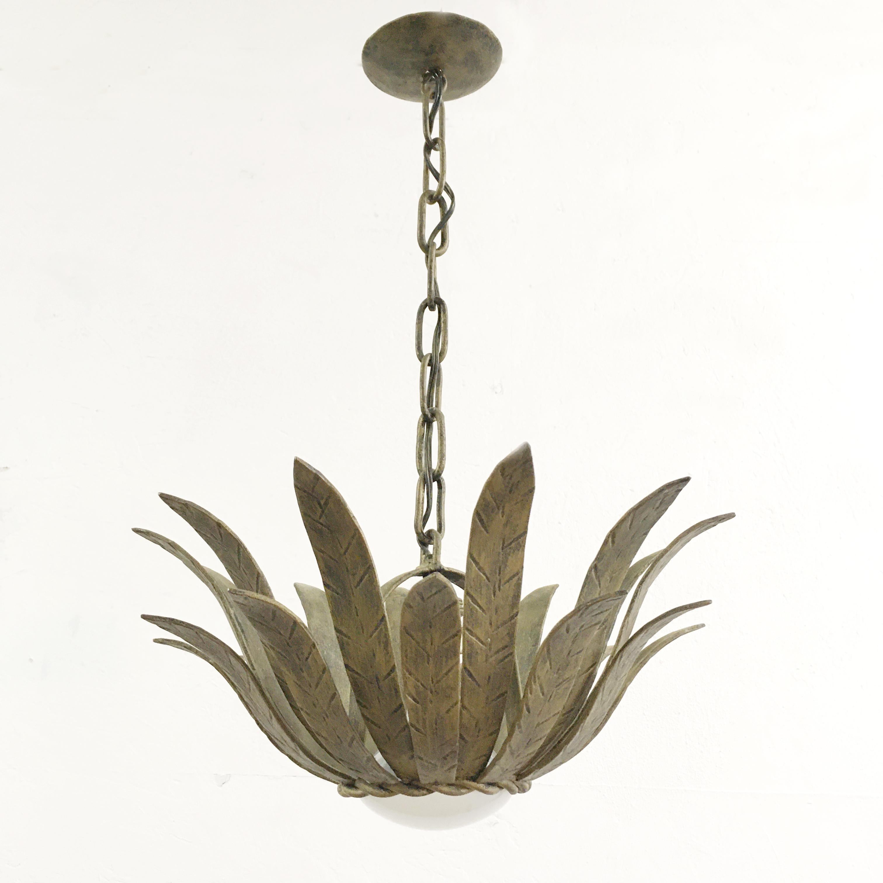 Spanish flower hanging ceiling light, circa 1950s. Heavy metal light handcrafted and forged. Gold color. The light will take any E27 standard screw in bulb, a large spotlight bulb is shown in the photograph as the fill the opening of the light