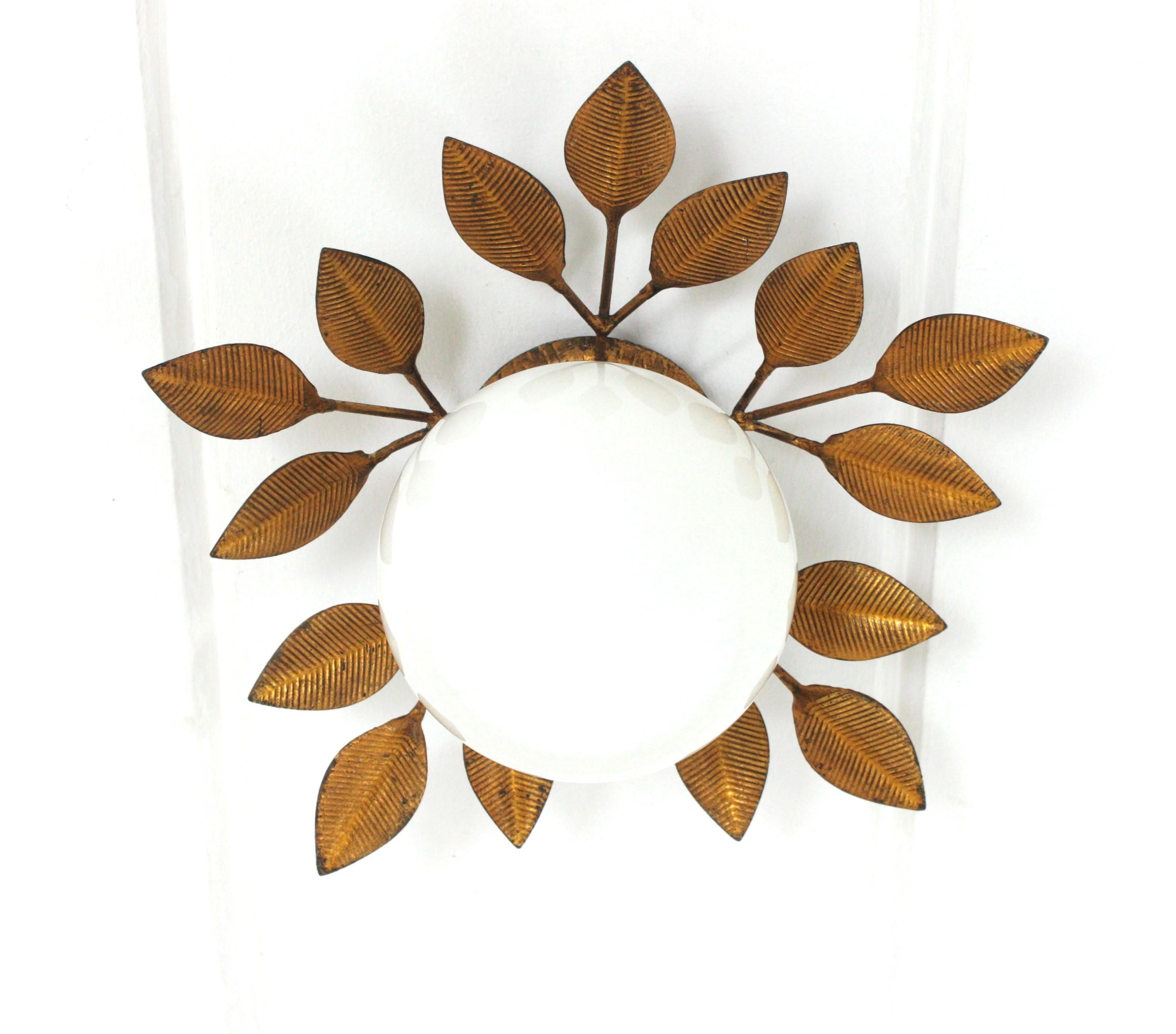 Ferro Art Leafed Light Fixture with Milk Glass Globe
Eye-catching flush mount or wall light with handblown white glass globe shade and gilt iron foliage frame. Manufactured by Ferro Art, Spain, 1960s.
This lovely ceiling light has a nice design with
