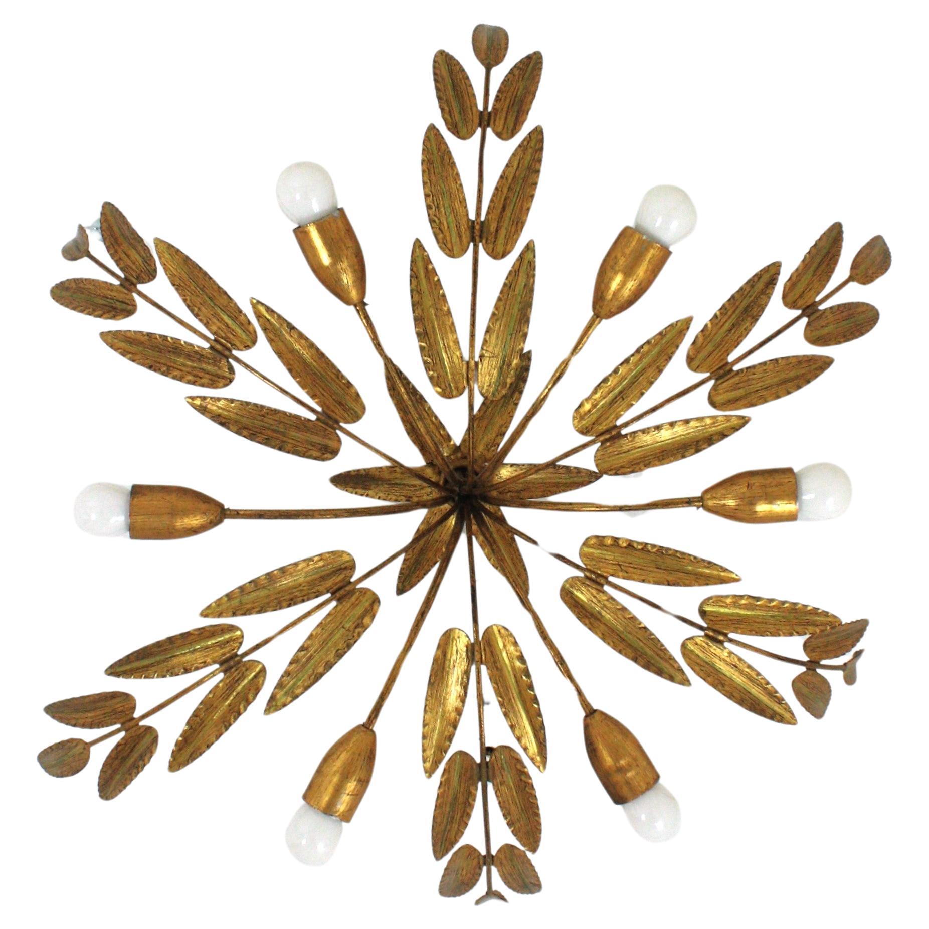 Outstanding spanish foliage sunburst flush mount ceiling light in gilt iron, Ferro Art, 1950s
Extra Large size ( 34,6 inches diameter). Six Lights.
To be used as ceiling light fixture or as chandelier / pendant light adding a chain to the desired