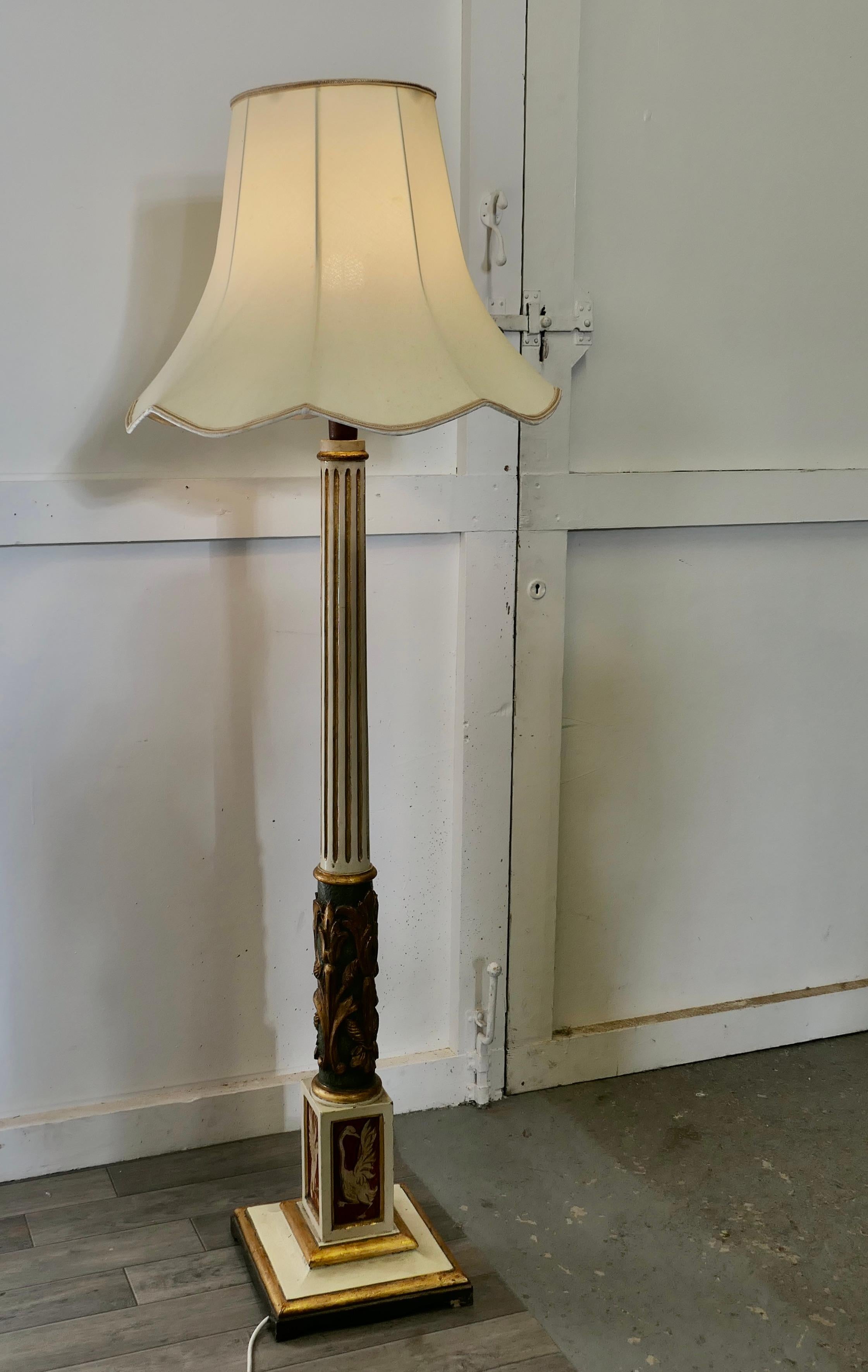 Spanish Folk Art floor standing standard lamp

 A traditionally turned, carved and painted piece from Spain. This wooden lamp stands on a square base, it is stepped at floor level above this is a Gilt and painted fluted column with carved and