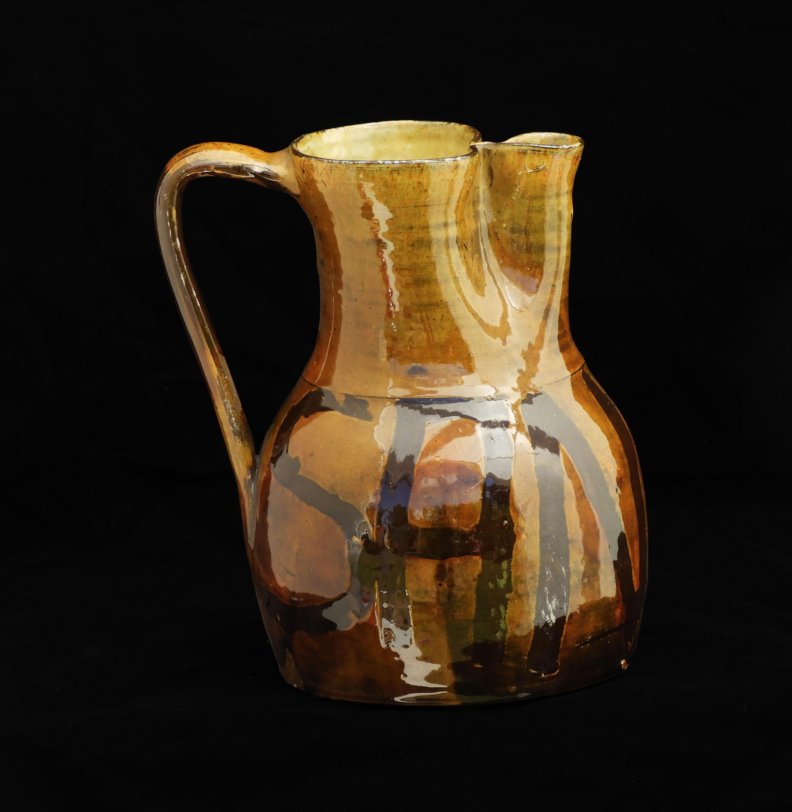 Spanish Folk Art Sangria Jug or Wine Pitcher  Early 20th Century.

Wonderful yellow ochre high glaze flat-bottomed ceramic vessel.   Beautiful and practical, a fabulous hand-crafted one-of-a-kind piece, perfect for summer entertaining!

.