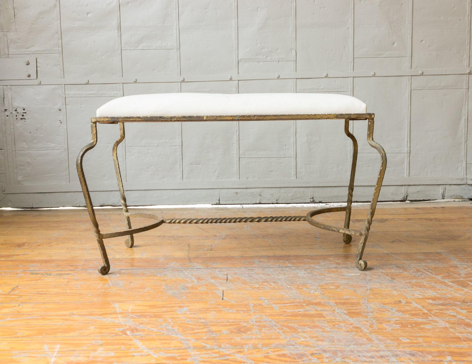Patinated gilt iron bench upholstered in white muslin. Spanish, 1950s. Very good vintage condition.