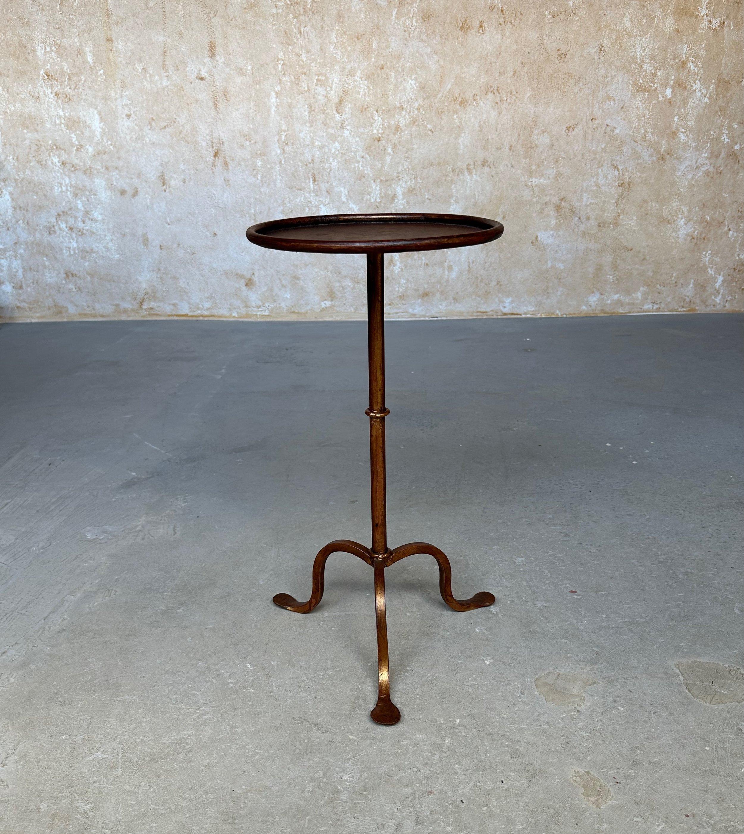 This recently crafted small Spanish gilt iron martini table is not only elegant but functional. Based on a vintage 1950s design, it was recently created by accomplished artisans using traditional iron-working methods with an emphasis on superior