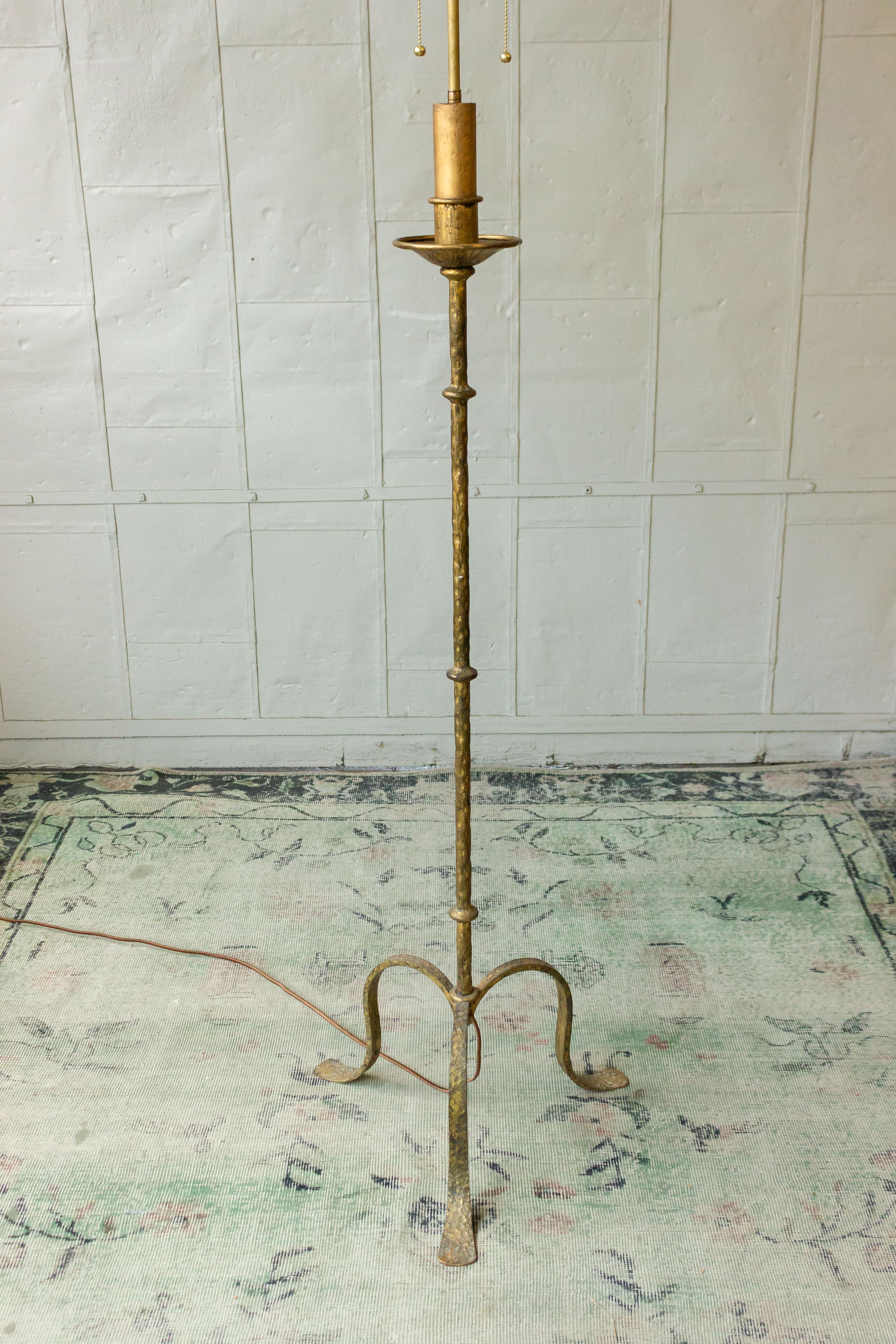 Spanish gilt iron floor lamp on a tripod base. Not sold with shade.
 