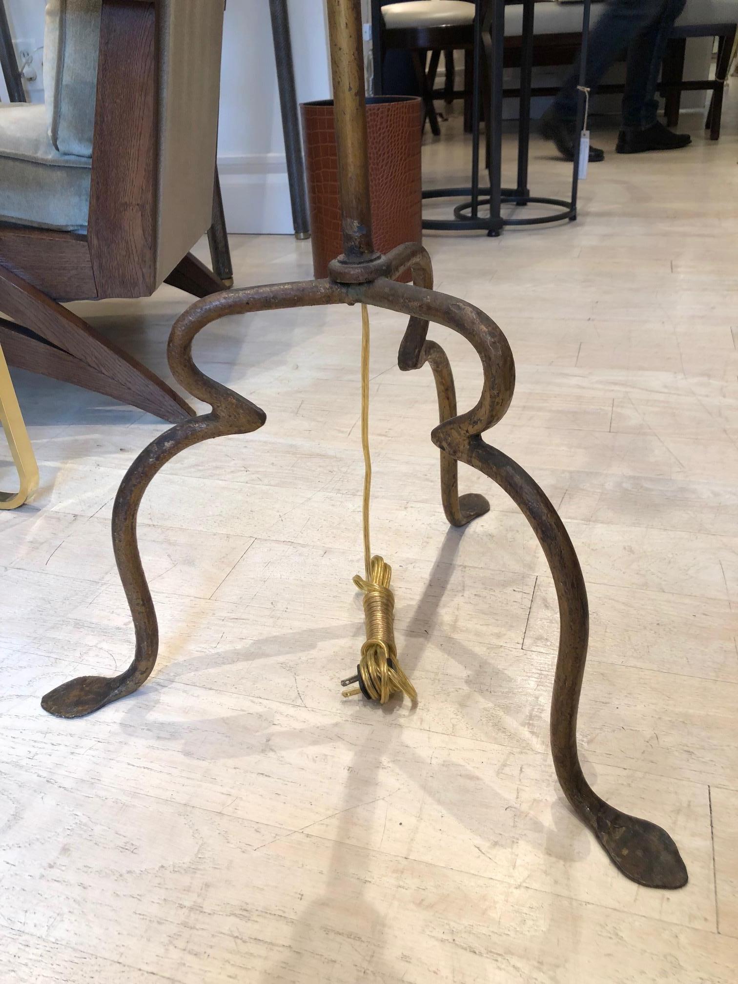 Gilt iron standing lamp on stylized tripod base. Spain, circa 1970's.
Recently rewired for US specifications (lamp shade not included)

Size: 22” Diameter 62” height.

 
Available to see in our NYC Showroom 
BK Antiques
306 East 61st St. 2nd fl.
New