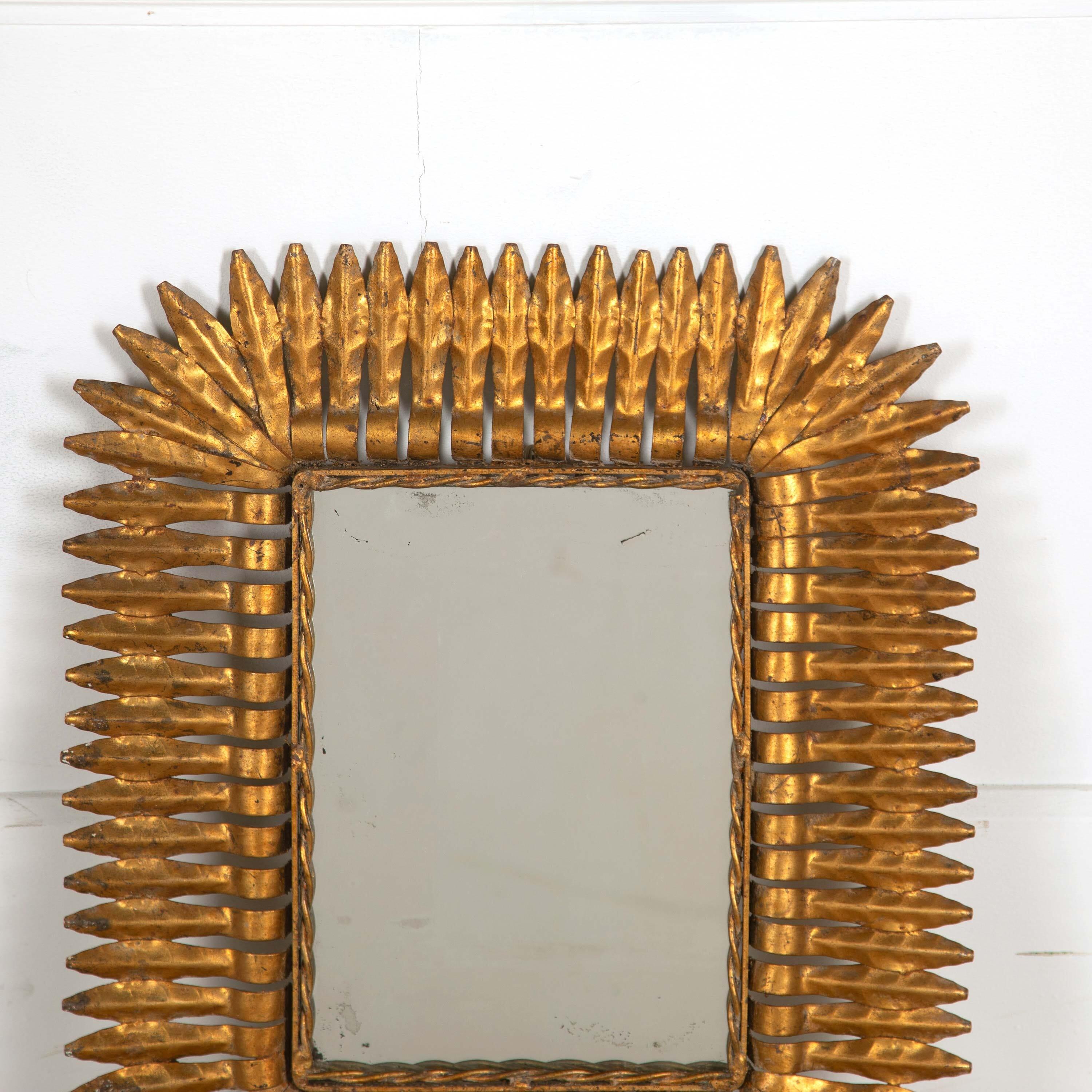 A bright Spanish gilt metal sunburst mirror, dates to 1920s.