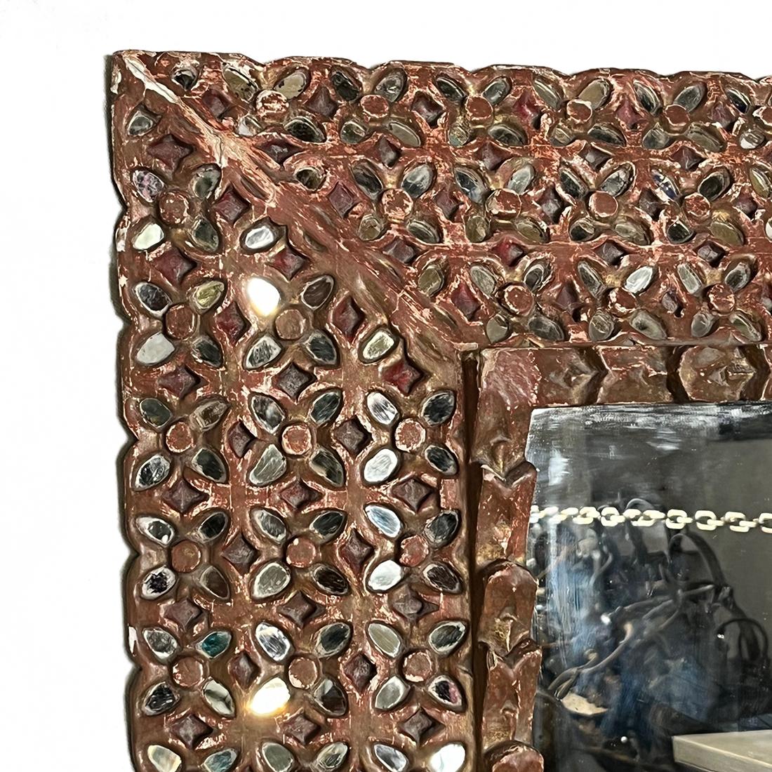 A circa 1940's Spanish gilt mirror with mirror insets.

Measurements:
Height: 31.5