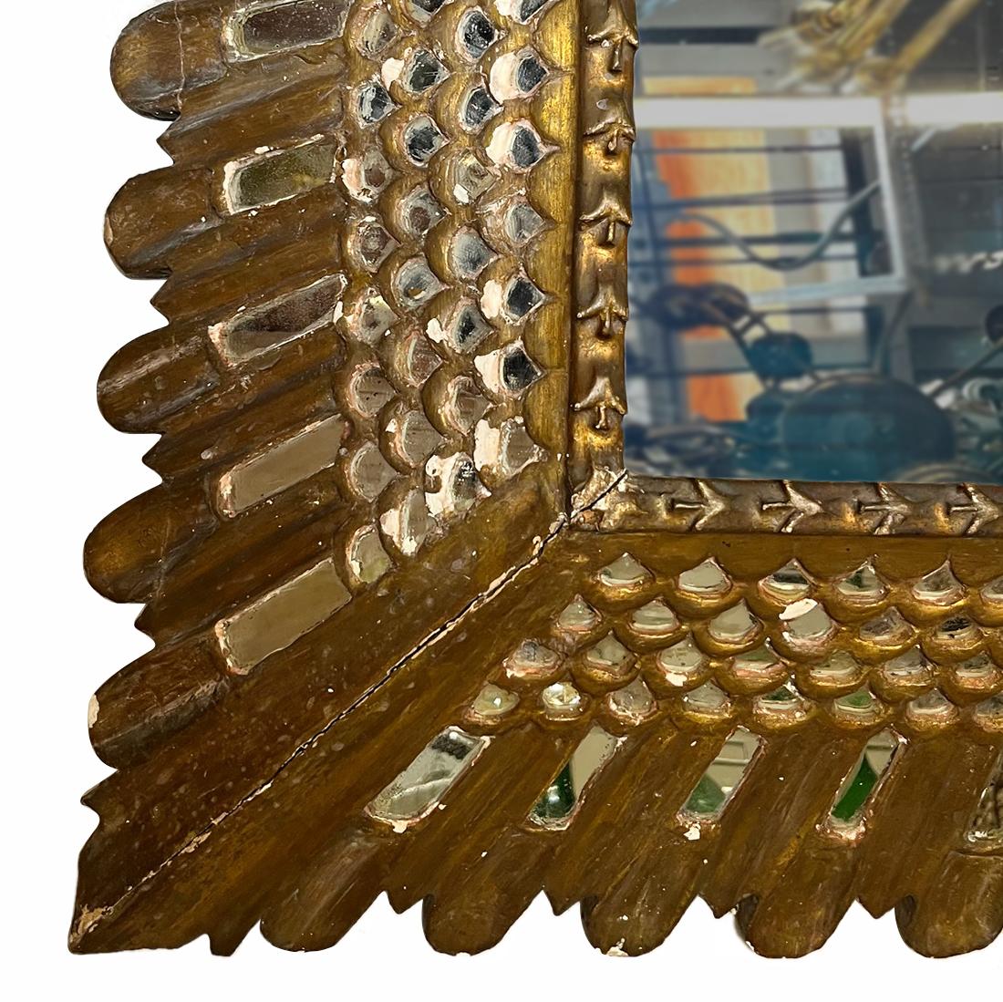 A circa 1940's Spanish gilt mirror with mirror insets.

Measurements:
Height: 31
Width: 31