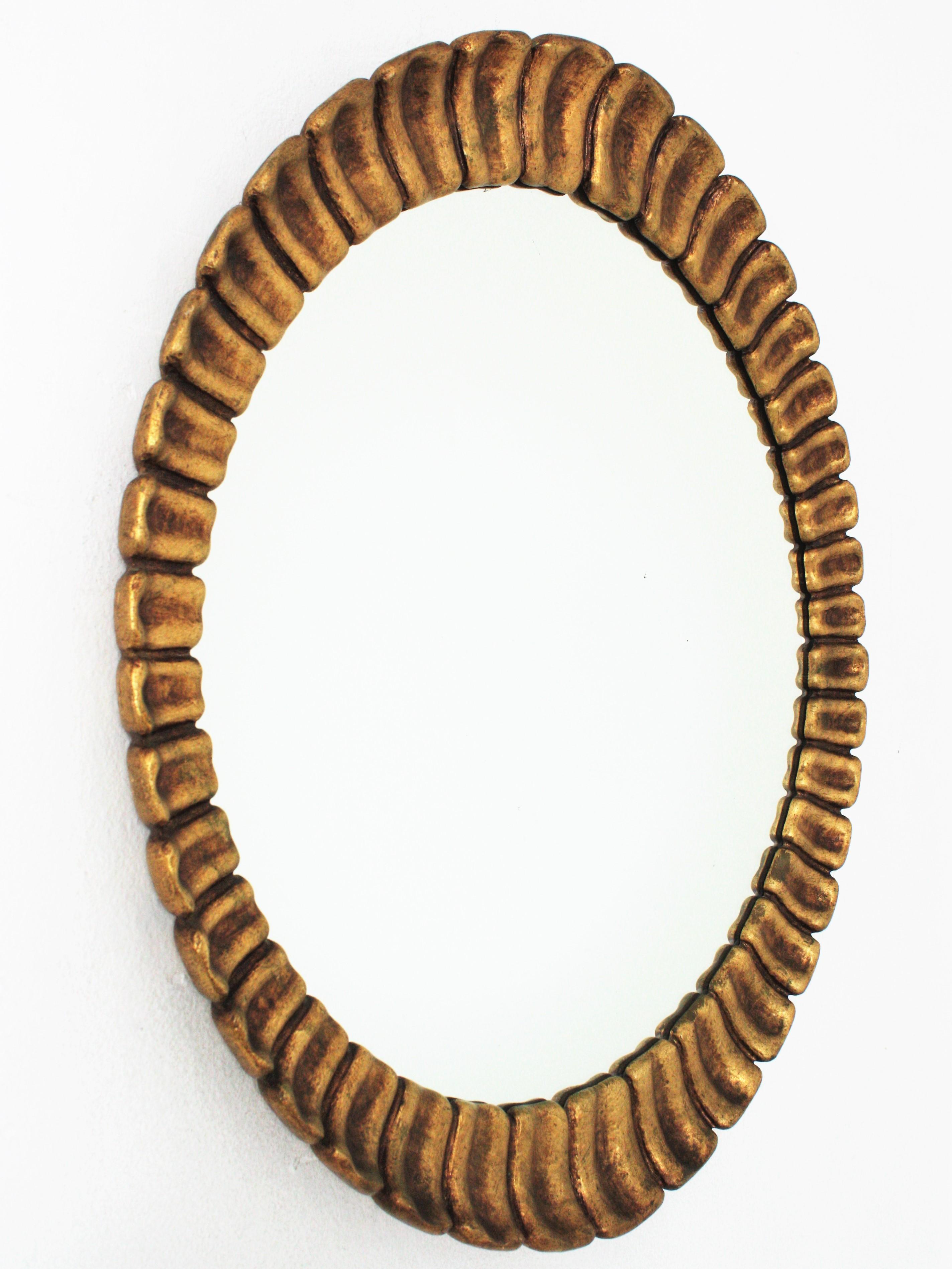 Mid-Century Modern Spanish Sunburst Giltwood Oval Mirror by Francisco Hurtado For Sale
