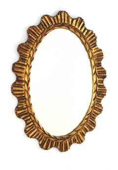 Spanish Giltwood Oval Sunburst Mirror, 1950s