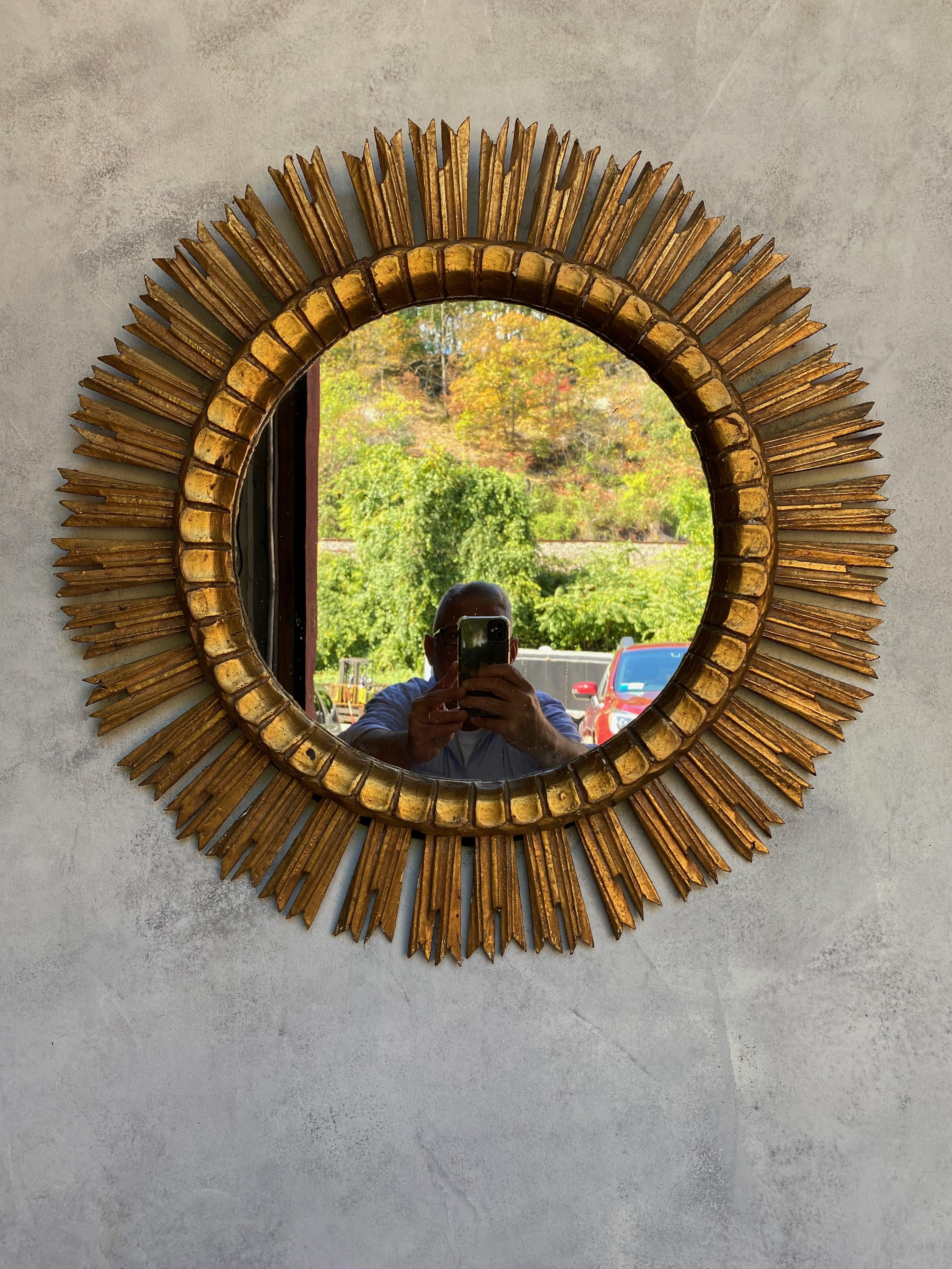 Mid-20th Century Spanish Giltwood Sunburst Mirror with Carved Frame