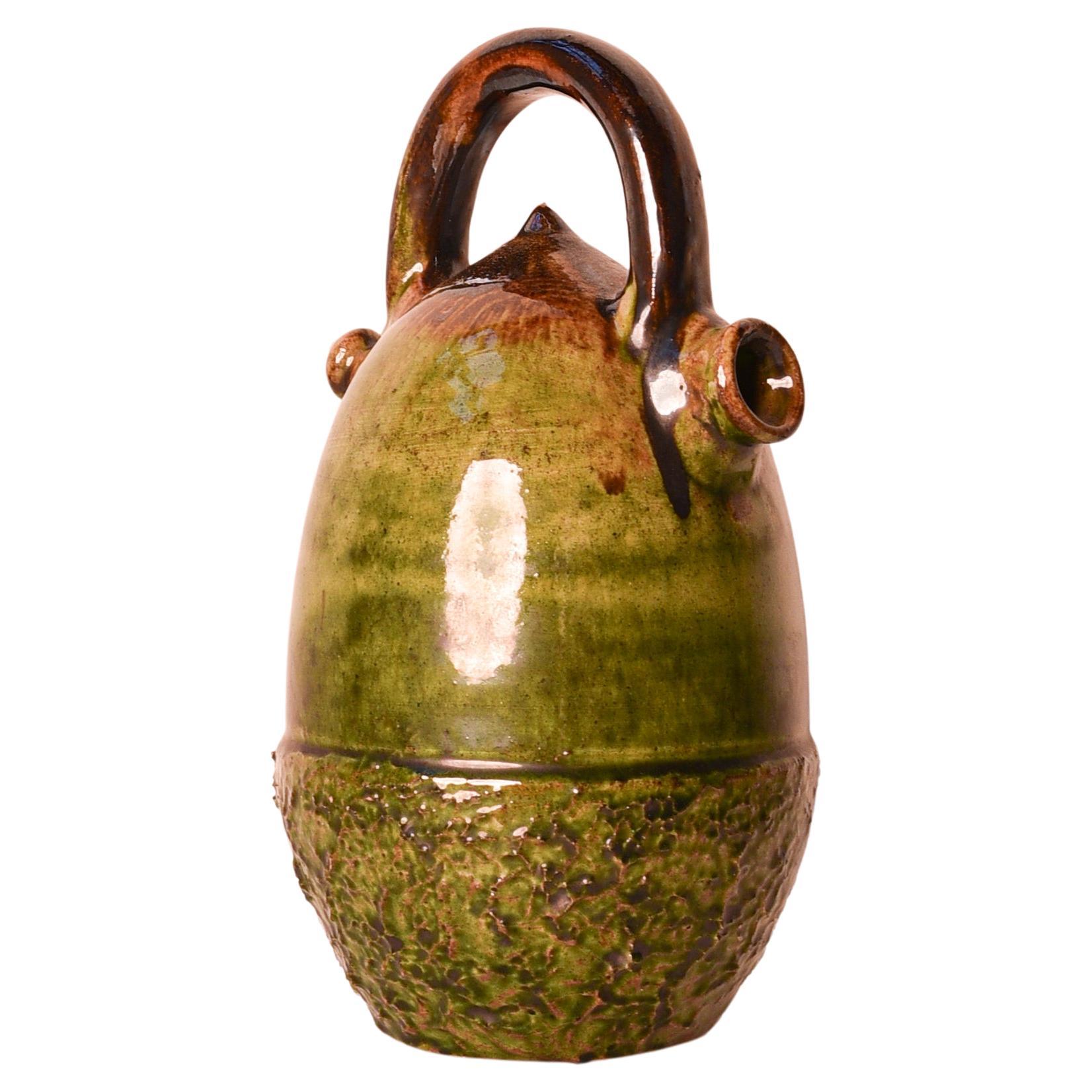 Spanish glazed terracotta botijo/ búcaro or water jar in the shape of an acorn For Sale