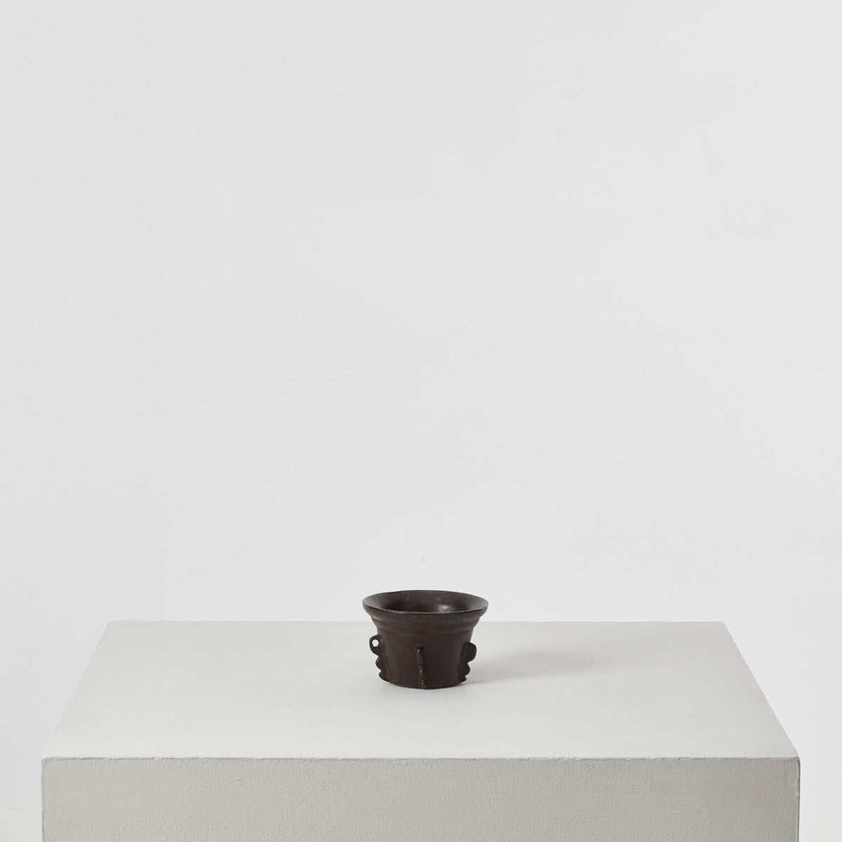 Mortars are an ancient culinary tool, described as indispensable to the preparation of food and medicines in texts like the Egyptian Ebers Papyrus, dating from 1550 BC, and the writings of the Roman poet Juvenal. This example is a beautifully