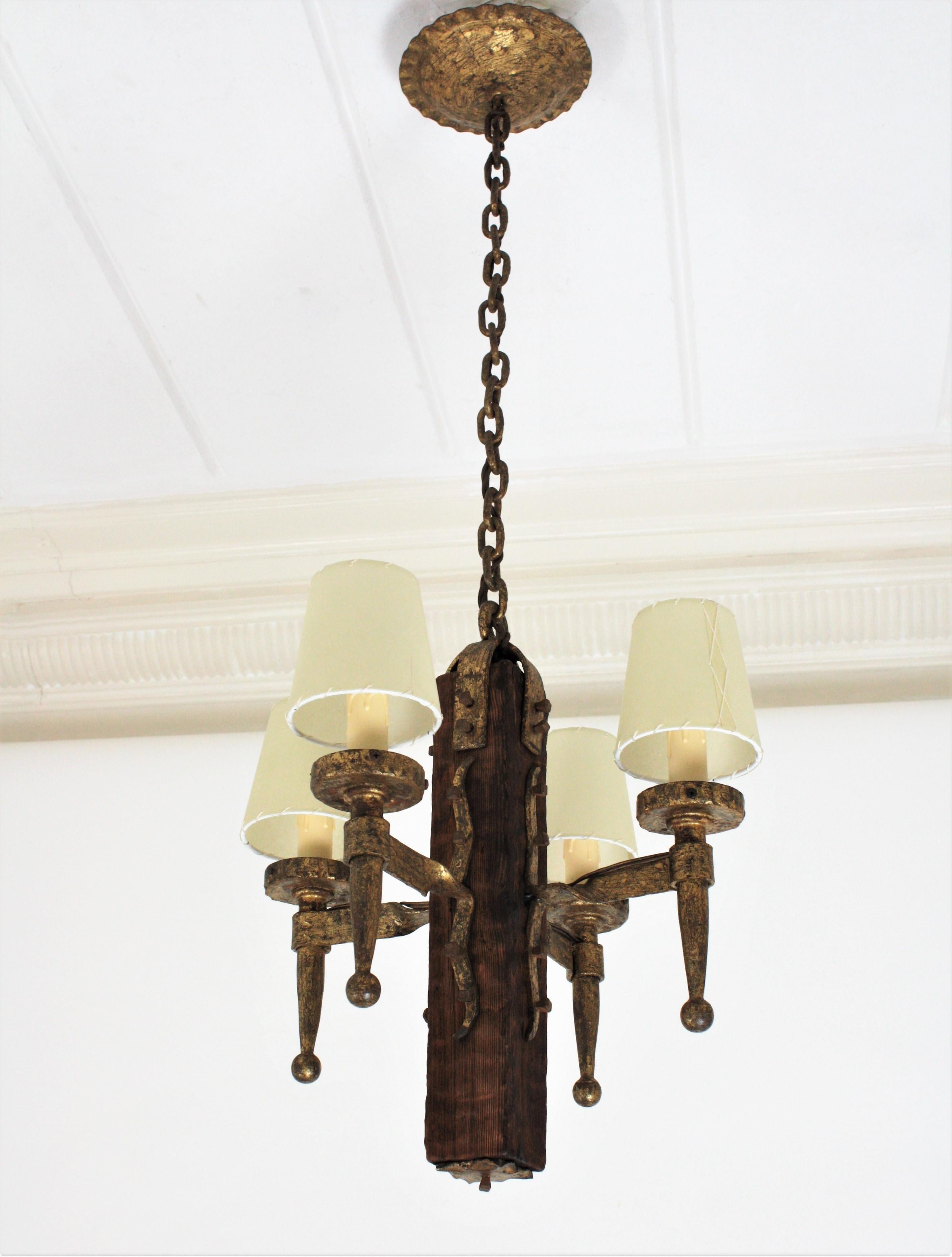 Gothic Revival Spanish Gothic Style Chandelier in Gilt Wrought Iron and Wood with Nail Details