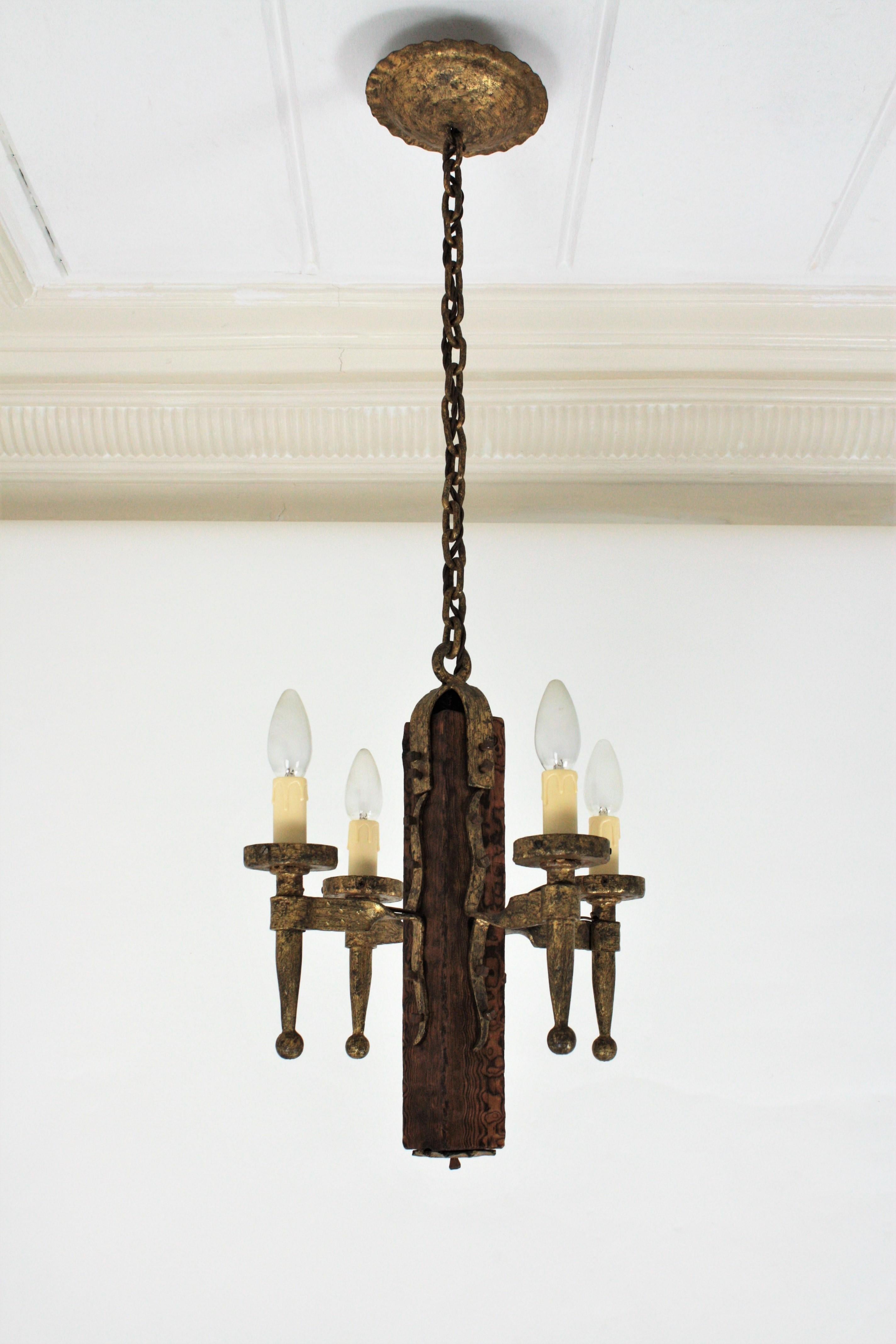 20th Century Spanish Gothic Style Chandelier in Gilt Wrought Iron and Wood with Nail Details