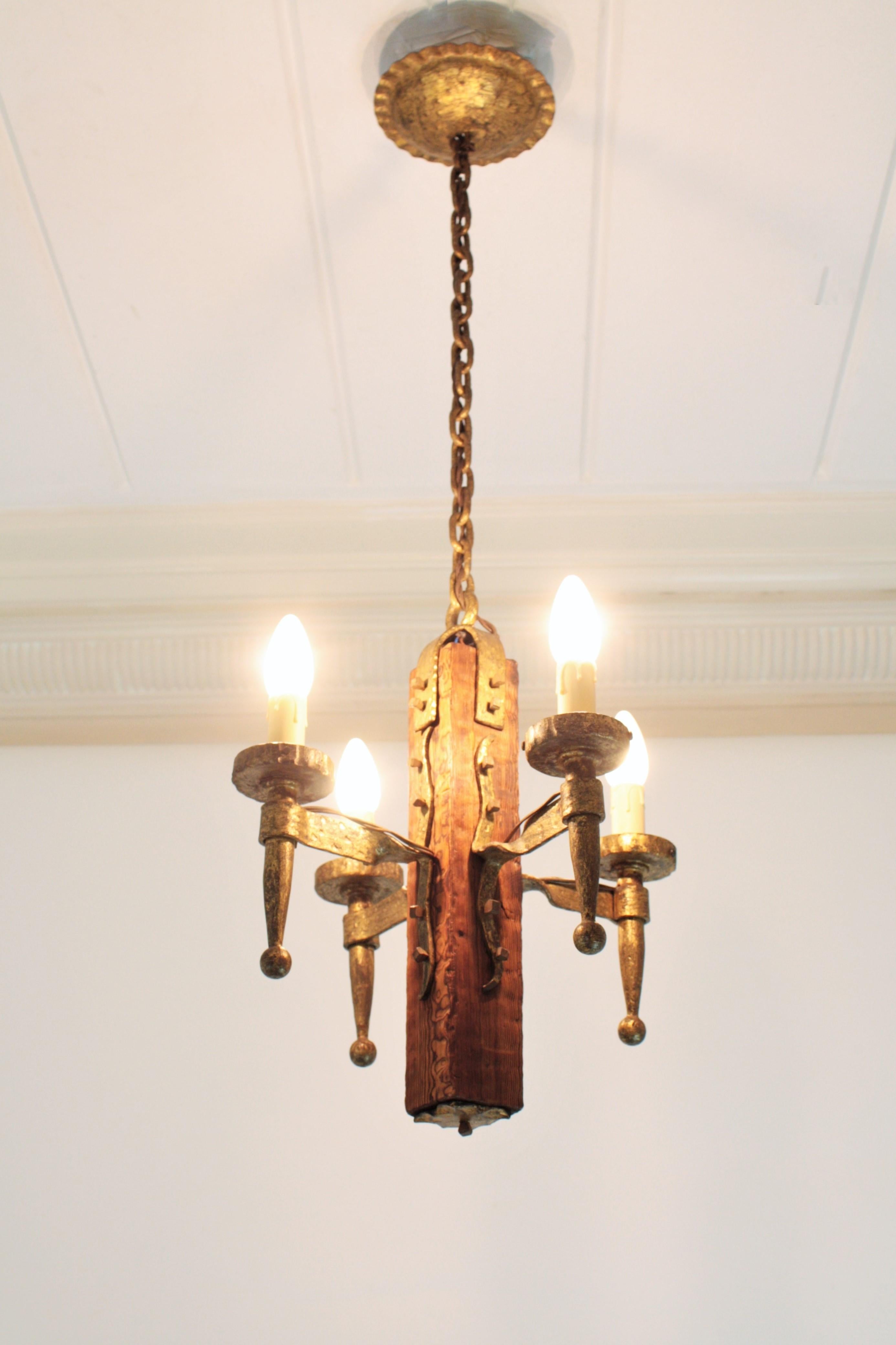 Spanish Gothic Style Chandelier in Gilt Wrought Iron and Wood with Nail Details 1