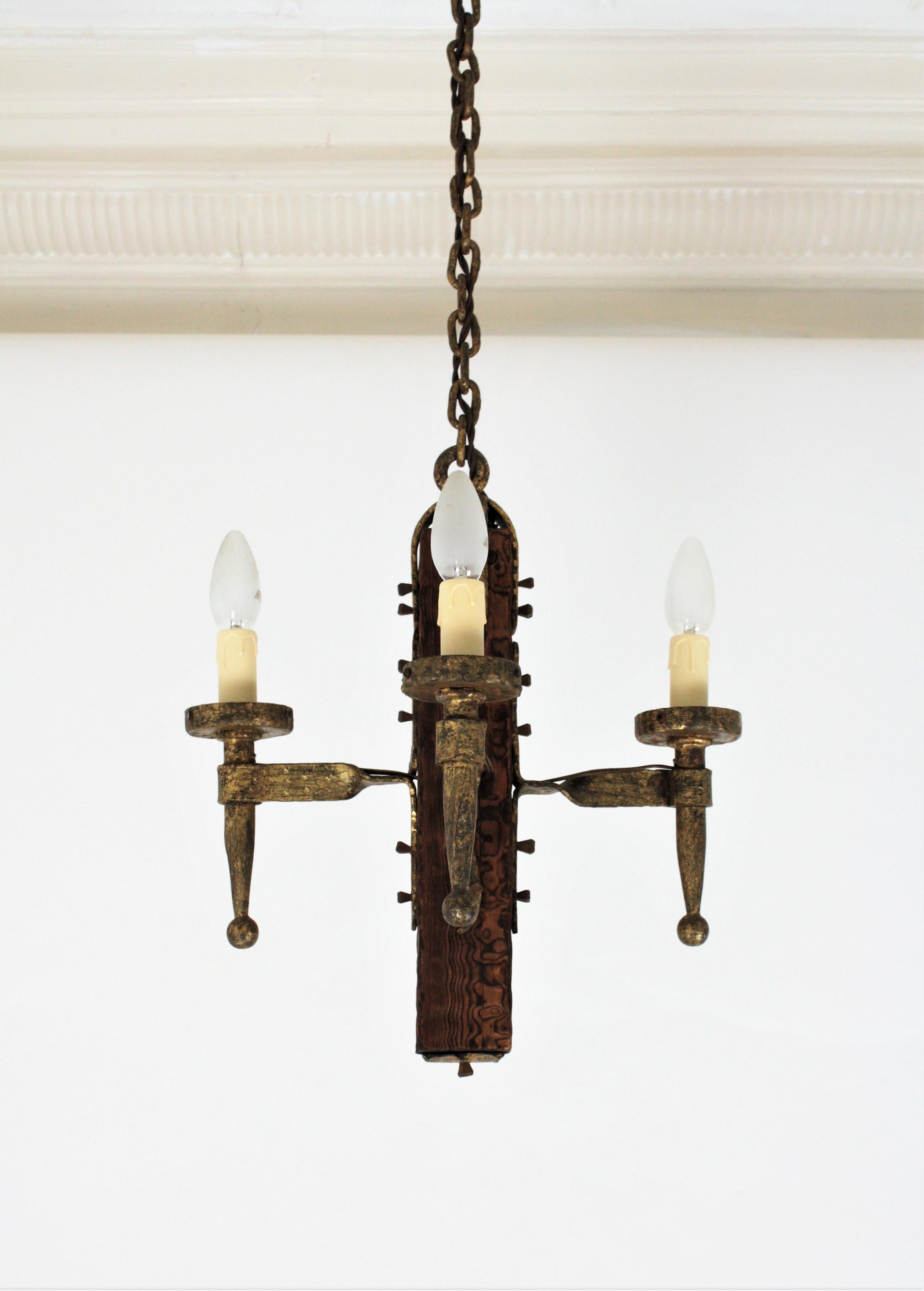 Spanish Gothic Style Chandelier in Gilt Wrought Iron and Wood with Nail Details 3