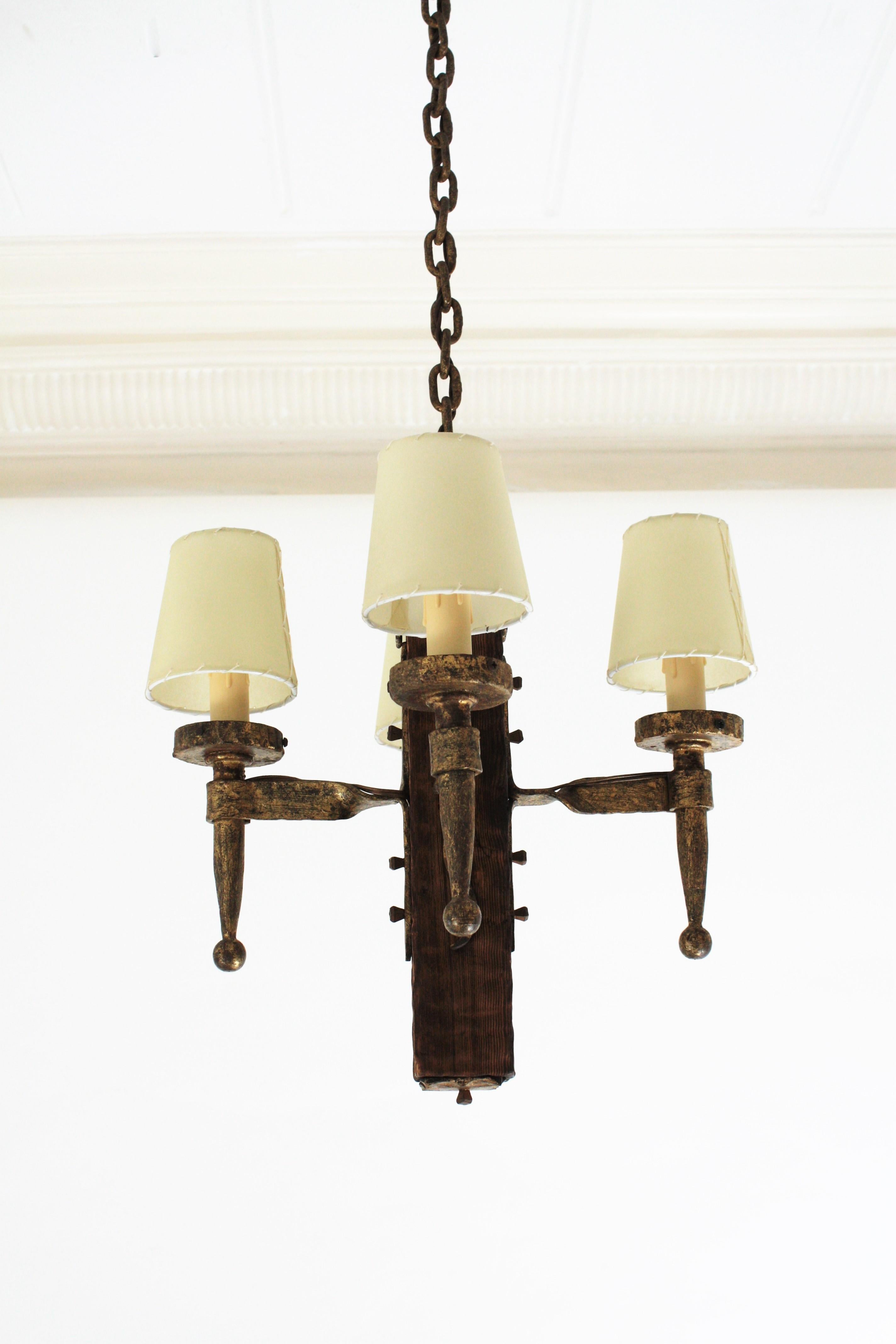 Spanish Gothic Style Chandelier in Gilt Wrought Iron and Wood with Nail Details 4
