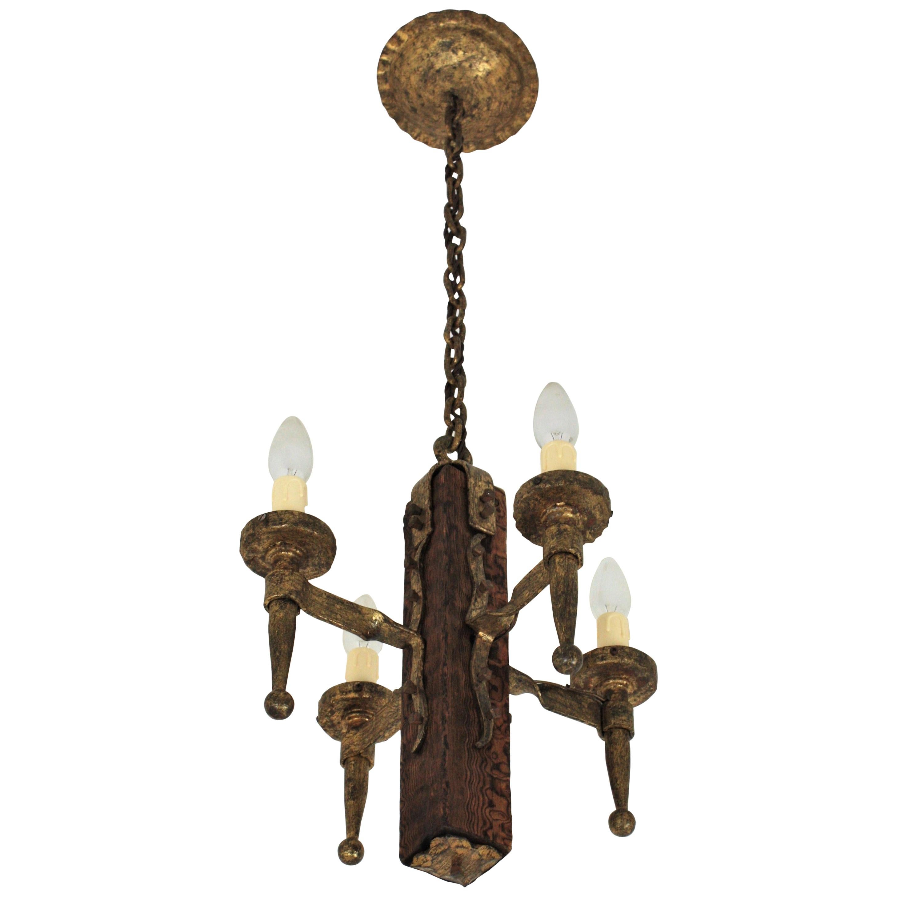 Spanish Gothic Style Chandelier in Gilt Wrought Iron and Wood with Nail Details