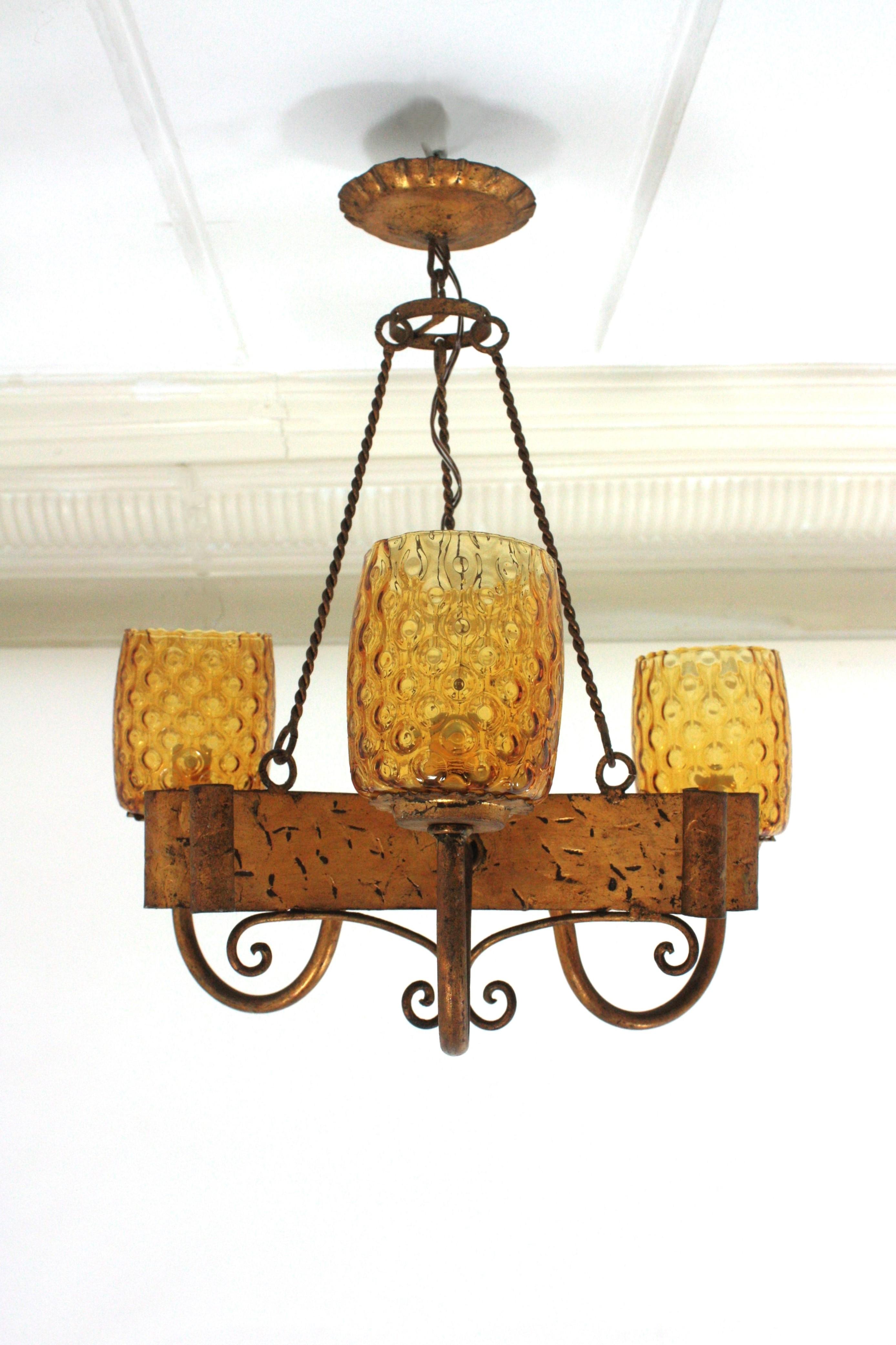 Forged Spanish Gothic Style Chandelier with Amber Glass Shades, Gilt Wrought Iron For Sale