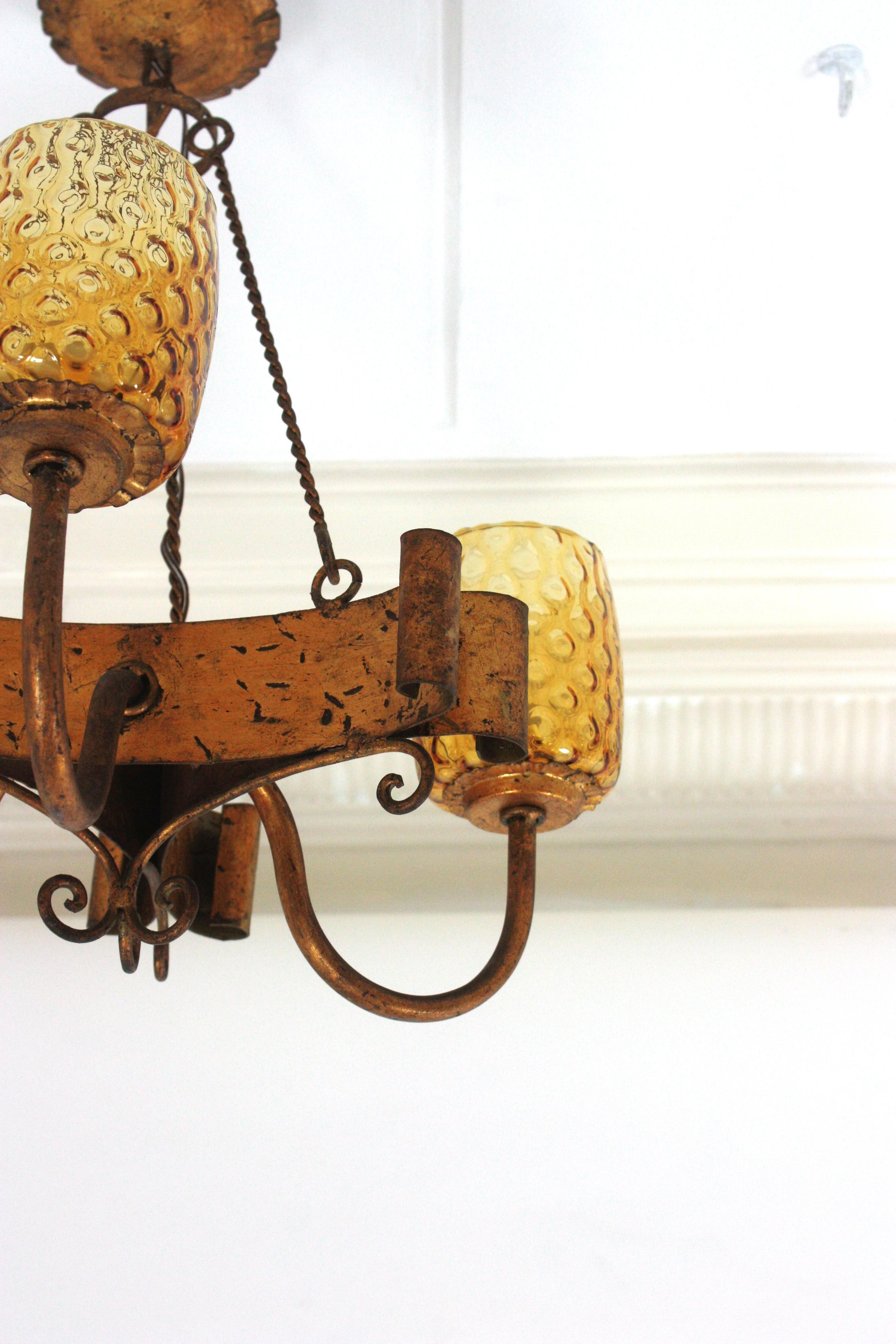 20th Century Spanish Gothic Style Chandelier with Amber Glass Shades, Gilt Wrought Iron For Sale