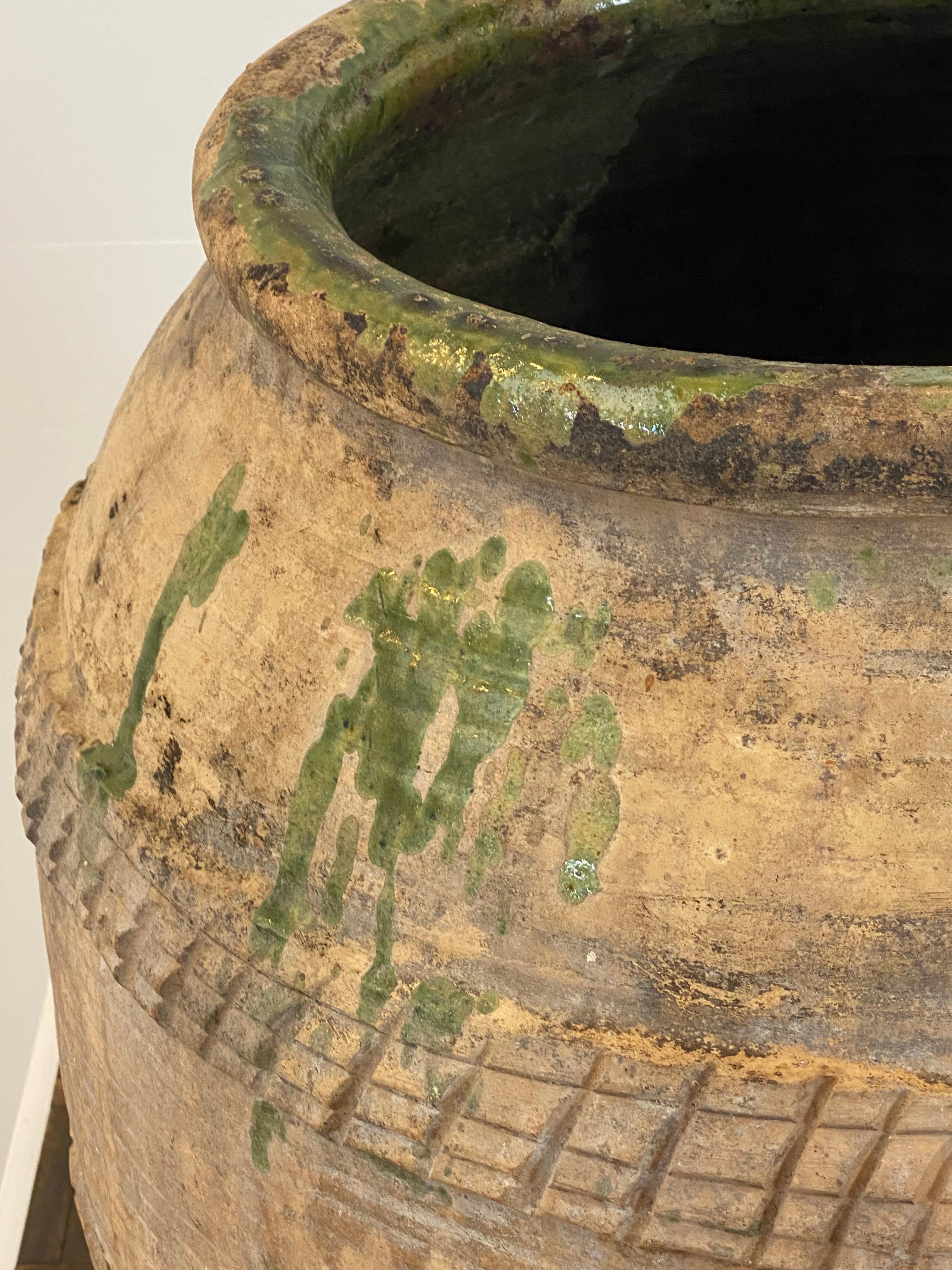 A very exceptional Spanish Terracotta Jar,Urn from the town Girona,
great old patina and traces of a Green Color,
3 special lines of carved decorations,
beautiful decorative object , can be used for several purposes.