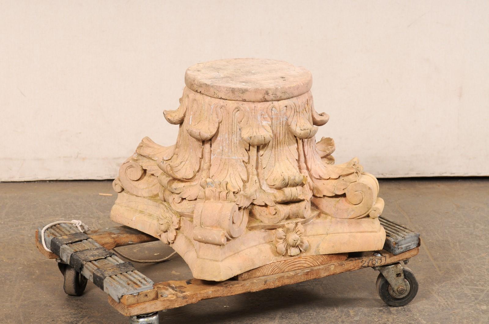 A Spanish carved-sandstone pedestal or column base. This vintage architectural stone column base from Spain, standing approximately 16.5 inches in height, has been hand-carved and features a flat, round-shaped top over the base with trunk-style body