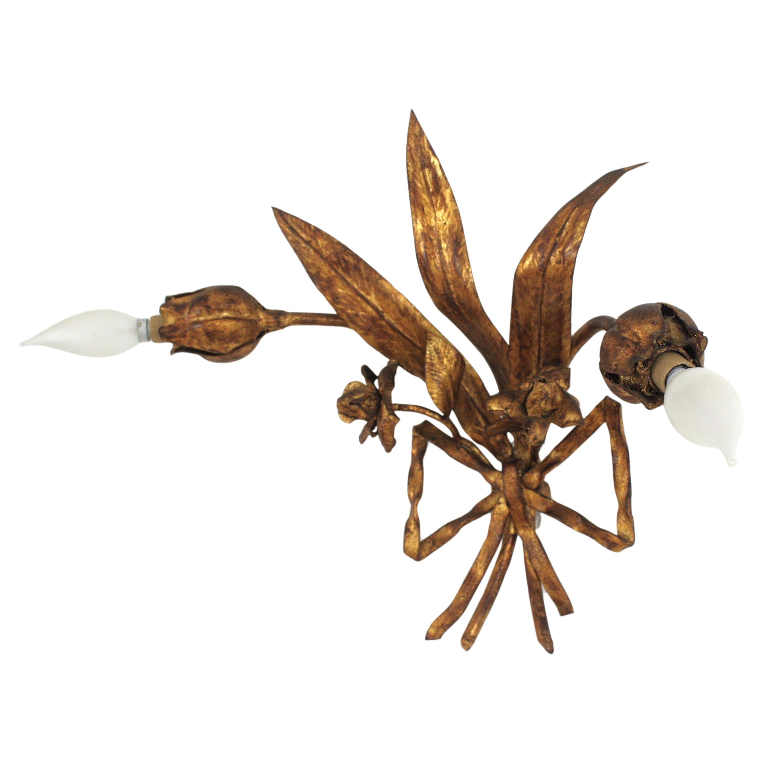 Hand Forged Flower Foliage Bouquet Wall Light, Gold Leaf, Gilt Iron, Spain, 1940s
One of a kind handcrafted iron wall sconce with foliage and floral motifs and tied bow detail.
Manufactured at the Hollywood Regency Period with Art Nouveau