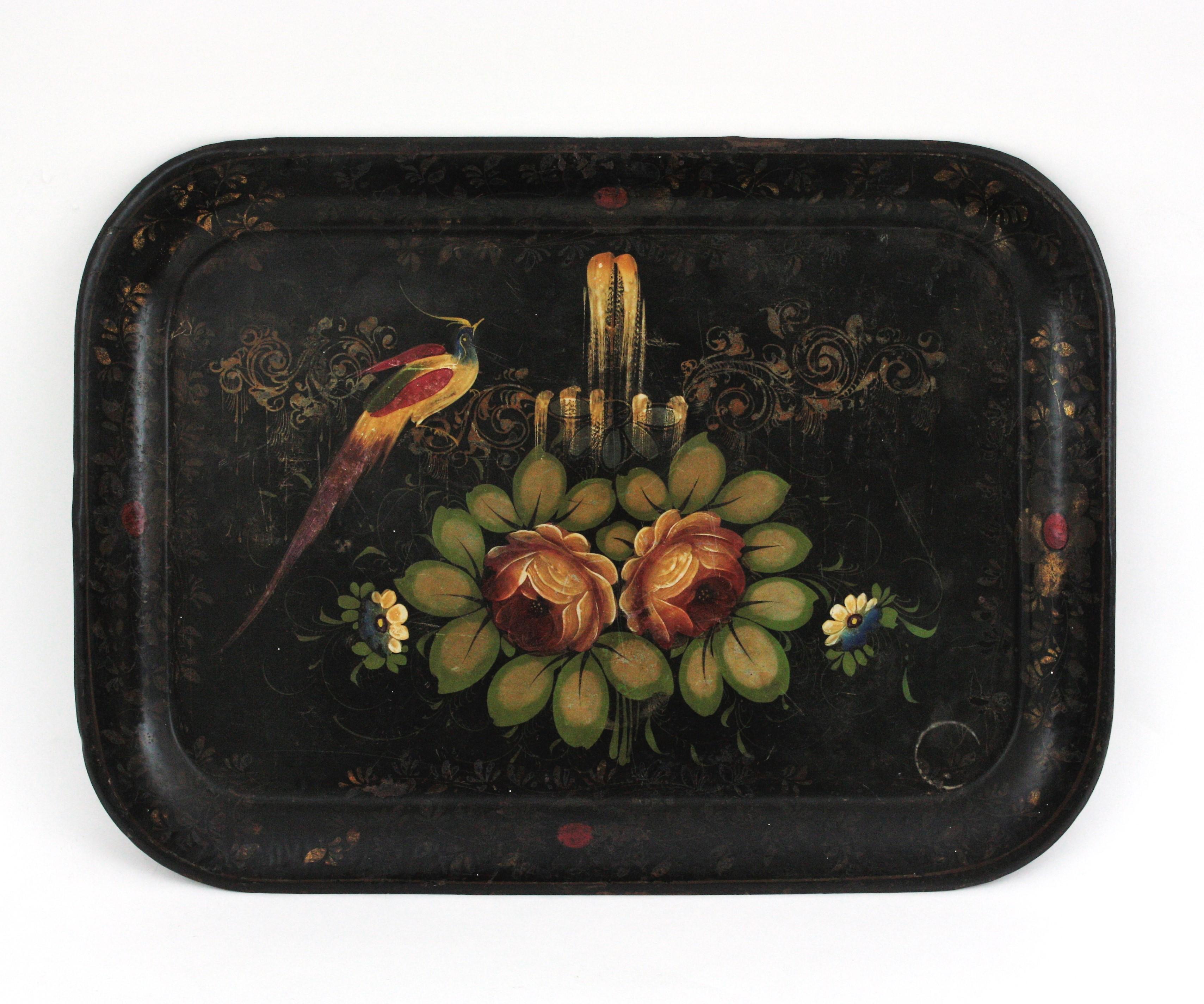 Spanish hand-painted black metal decorative tole tray, 1930s
Victorian style Tole tray with polychrome hand-painted floral and bird motif on a black lacquered background.
Lovely to be used as serving tray or as wall decoration
Good vintage