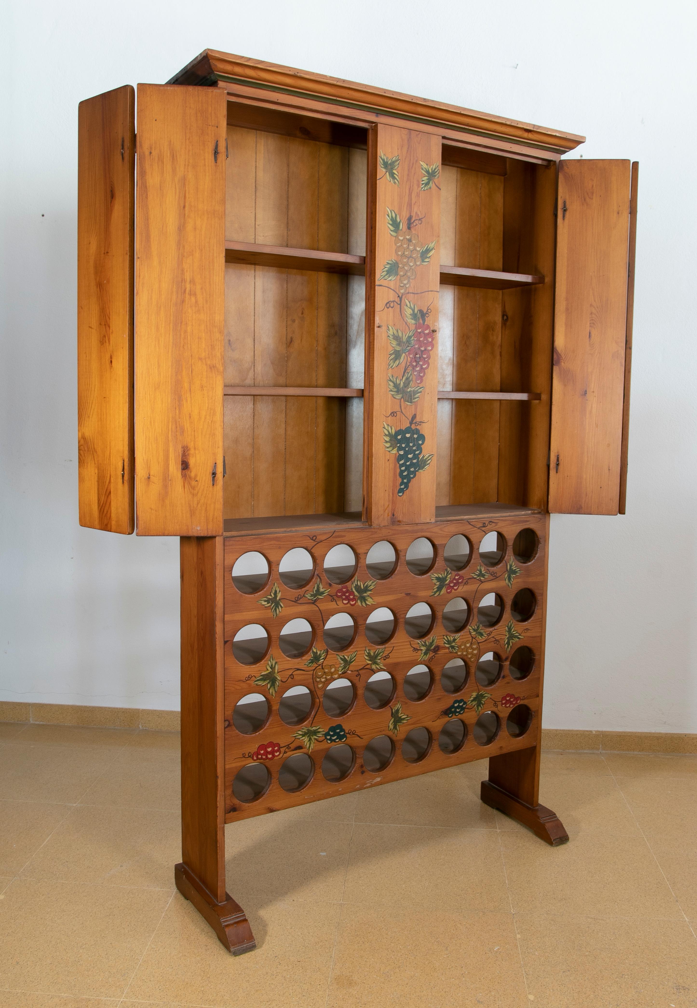 Spanish hand painted wooden wine bottle cabinet and doors.