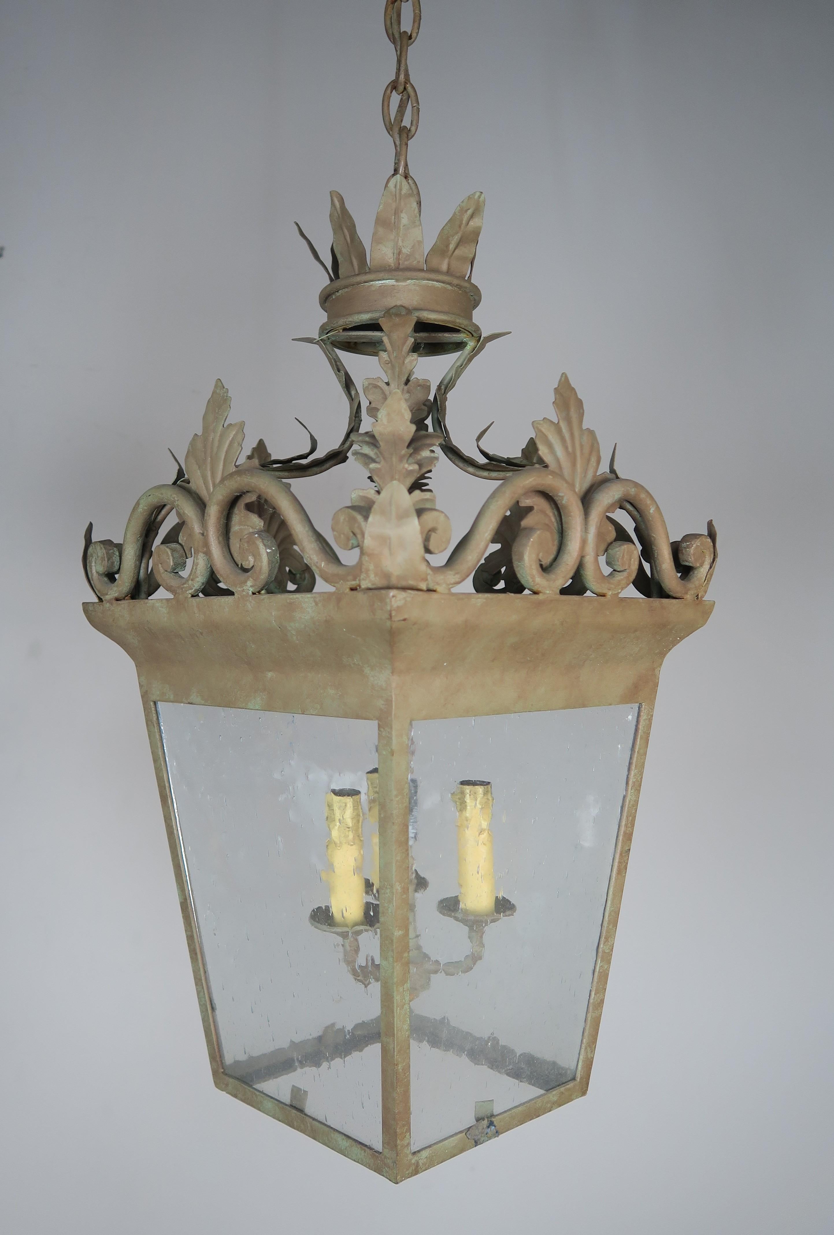 Spanish Hand-Wrought Iron Lanterns with Pitted Glass, Pair In Distressed Condition In Los Angeles, CA