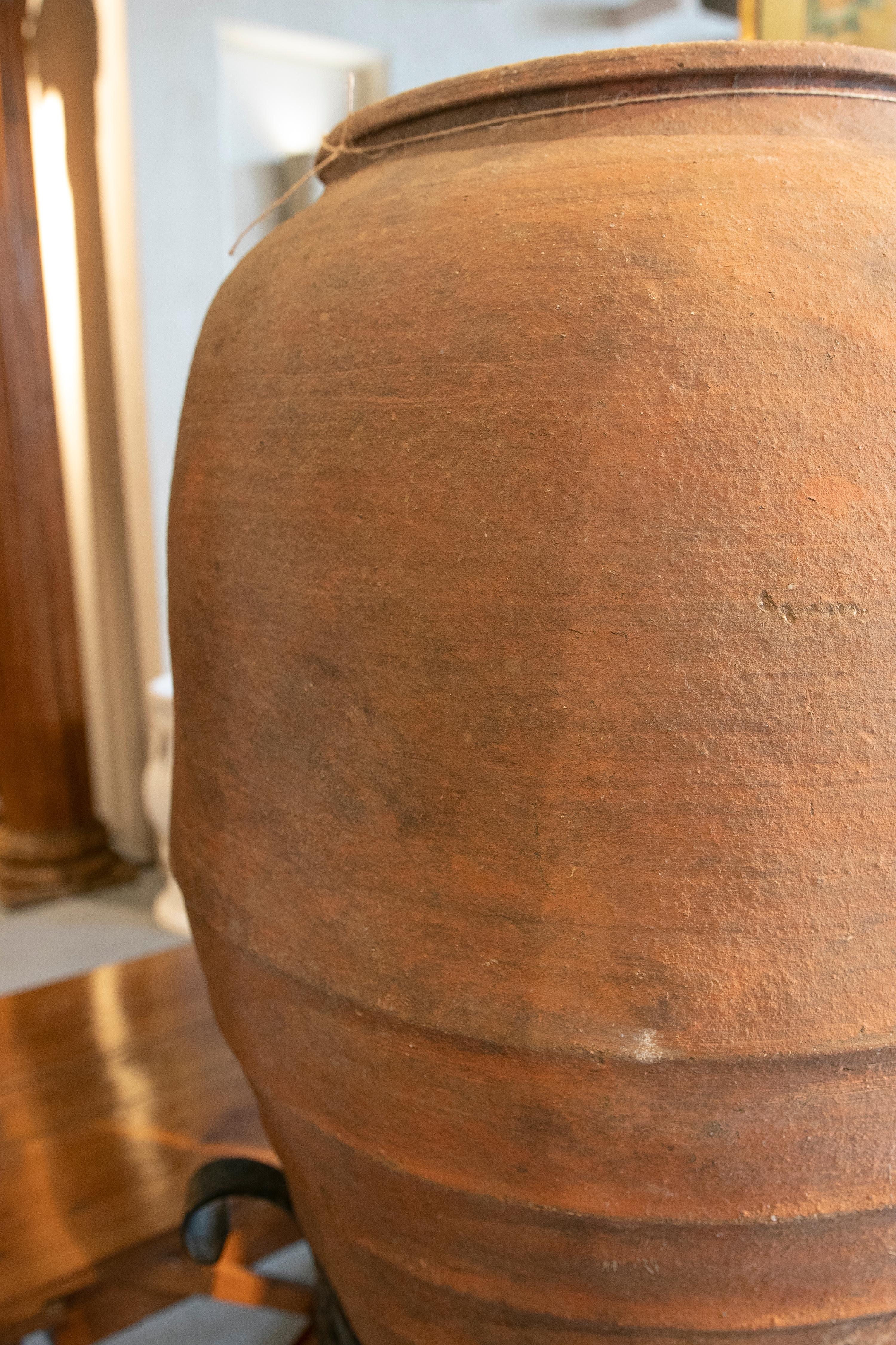 Spanish Handmade Ceramic Jar with Iron Base For Sale 11