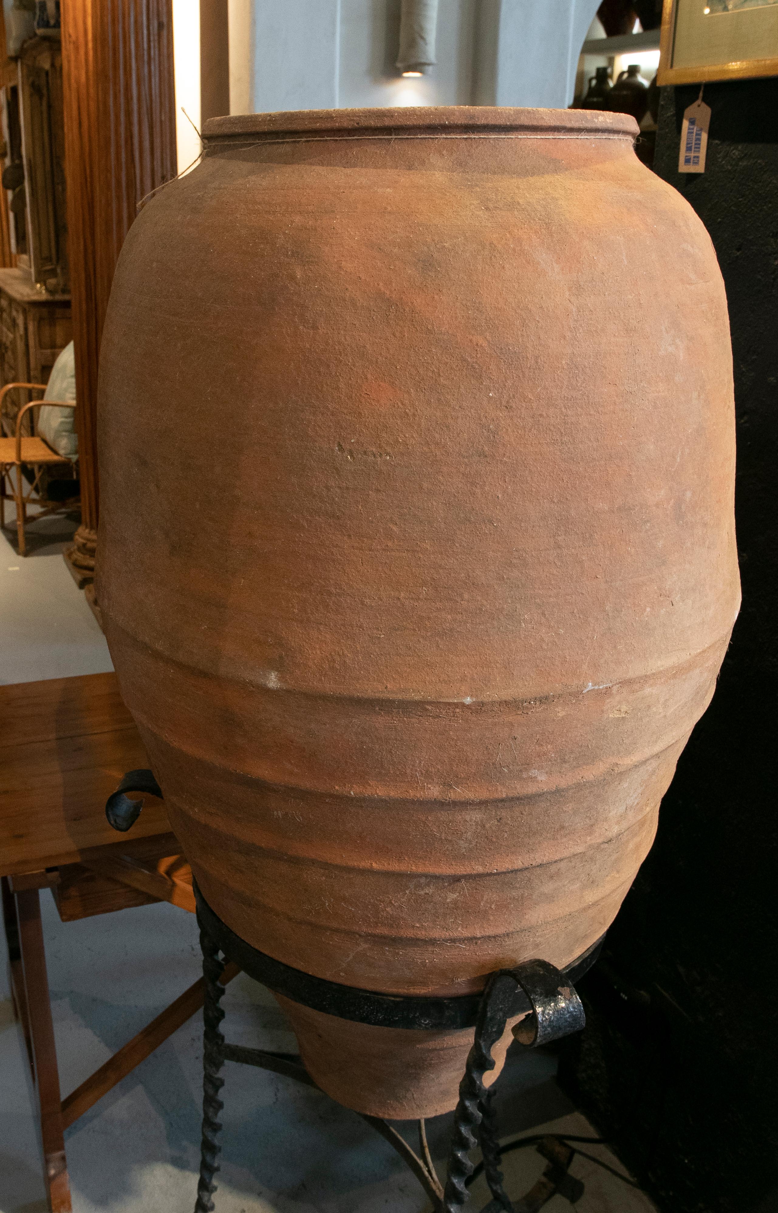 20th Century Spanish Handmade Ceramic Jar with Iron Base For Sale