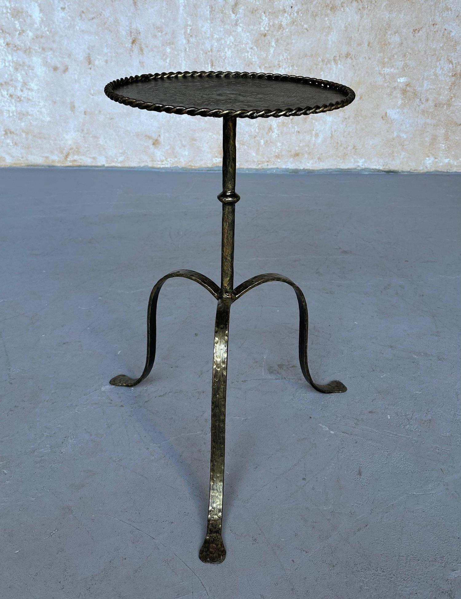 This ornate and unusual Spanish gilt metal side or drinks table was recently handcrafted by skilled artisans using conventional iron-working techniques with an emphasis on superior quality. It features a central stem with decorative ring detail