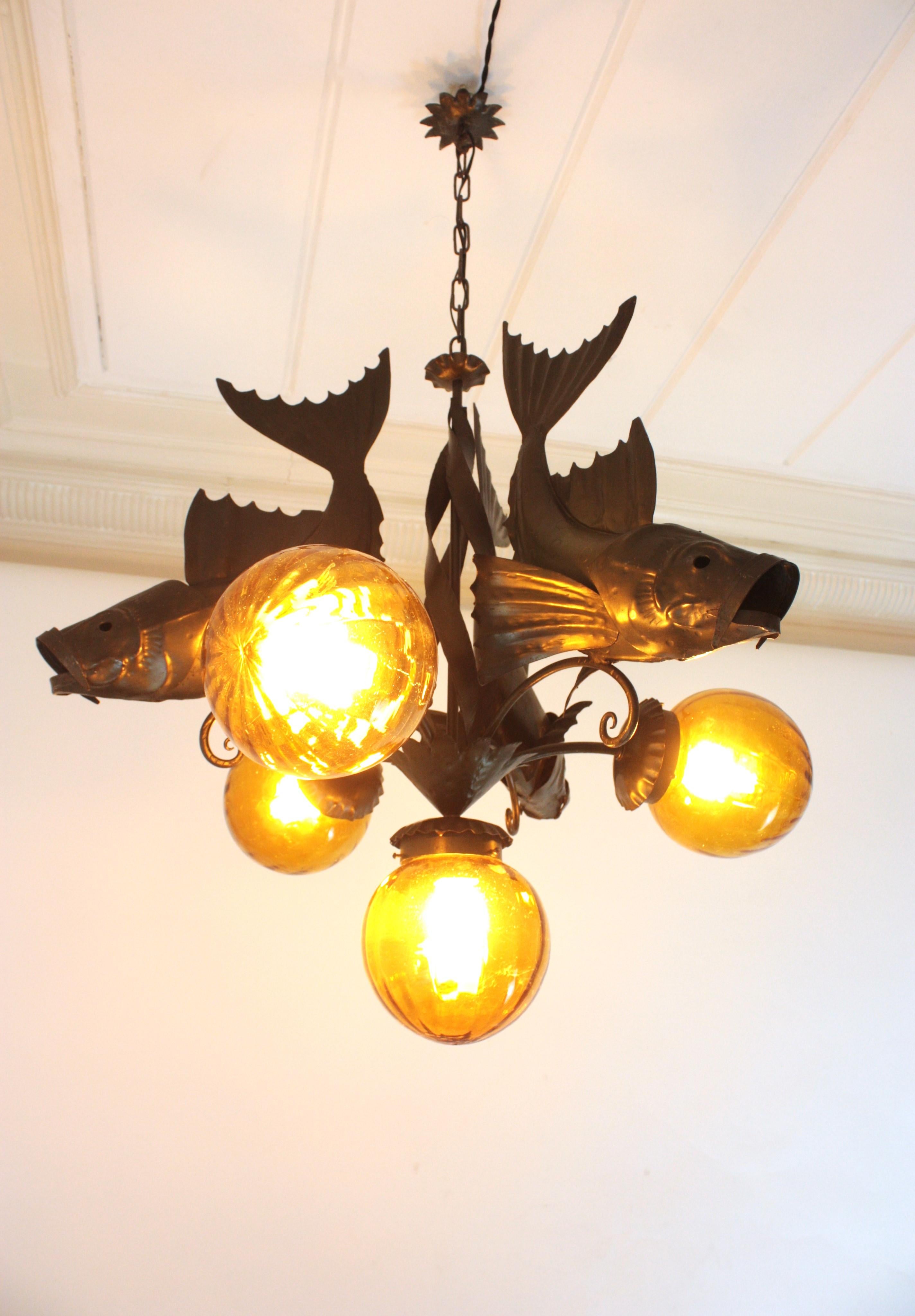 Mid-Century Modern Spanish Wrought Iron and Amber Glass Chandelier, Fish Design For Sale