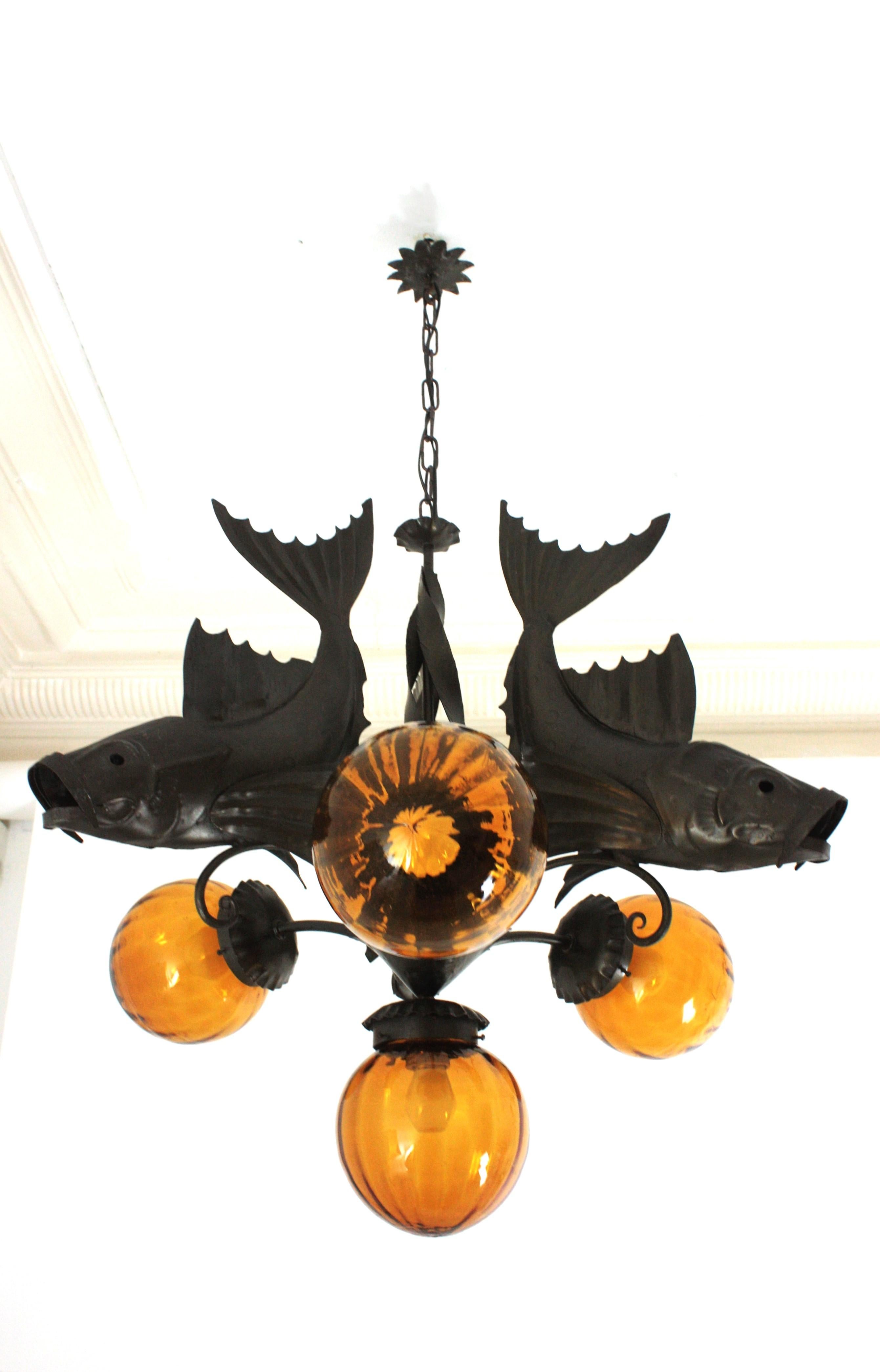 Hammered Spanish Wrought Iron and Amber Glass Chandelier, Fish Design For Sale