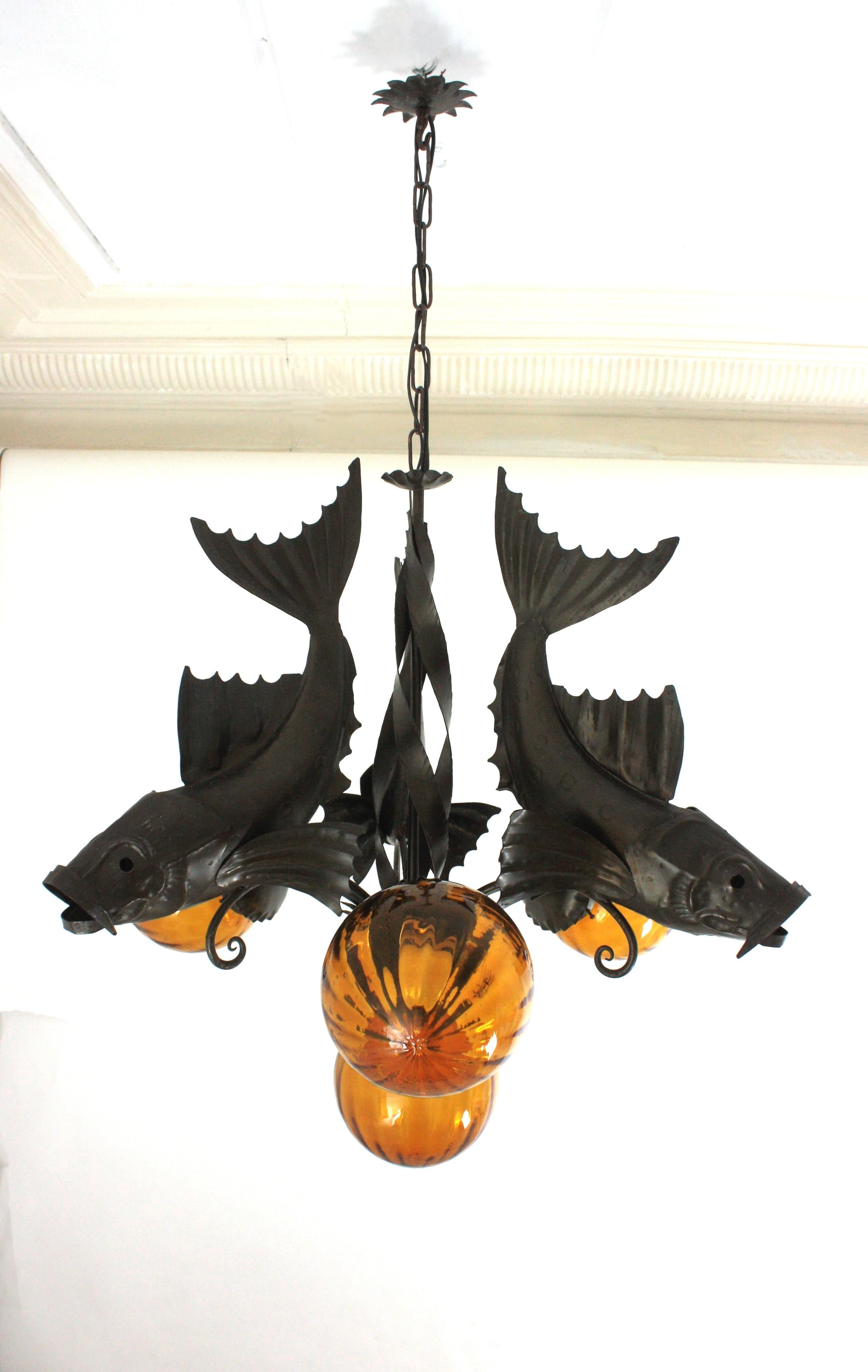 20th Century Spanish Wrought Iron and Amber Glass Chandelier, Fish Design For Sale