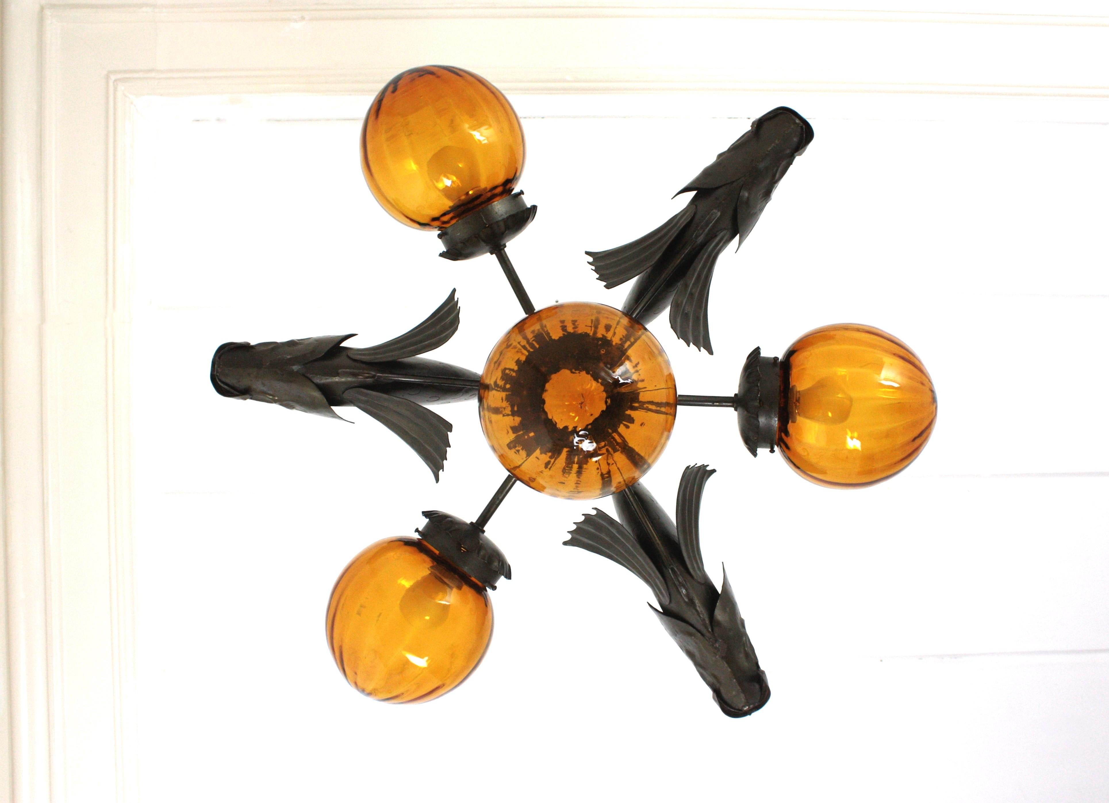 Spanish Wrought Iron and Amber Glass Chandelier, Fish Design For Sale 1