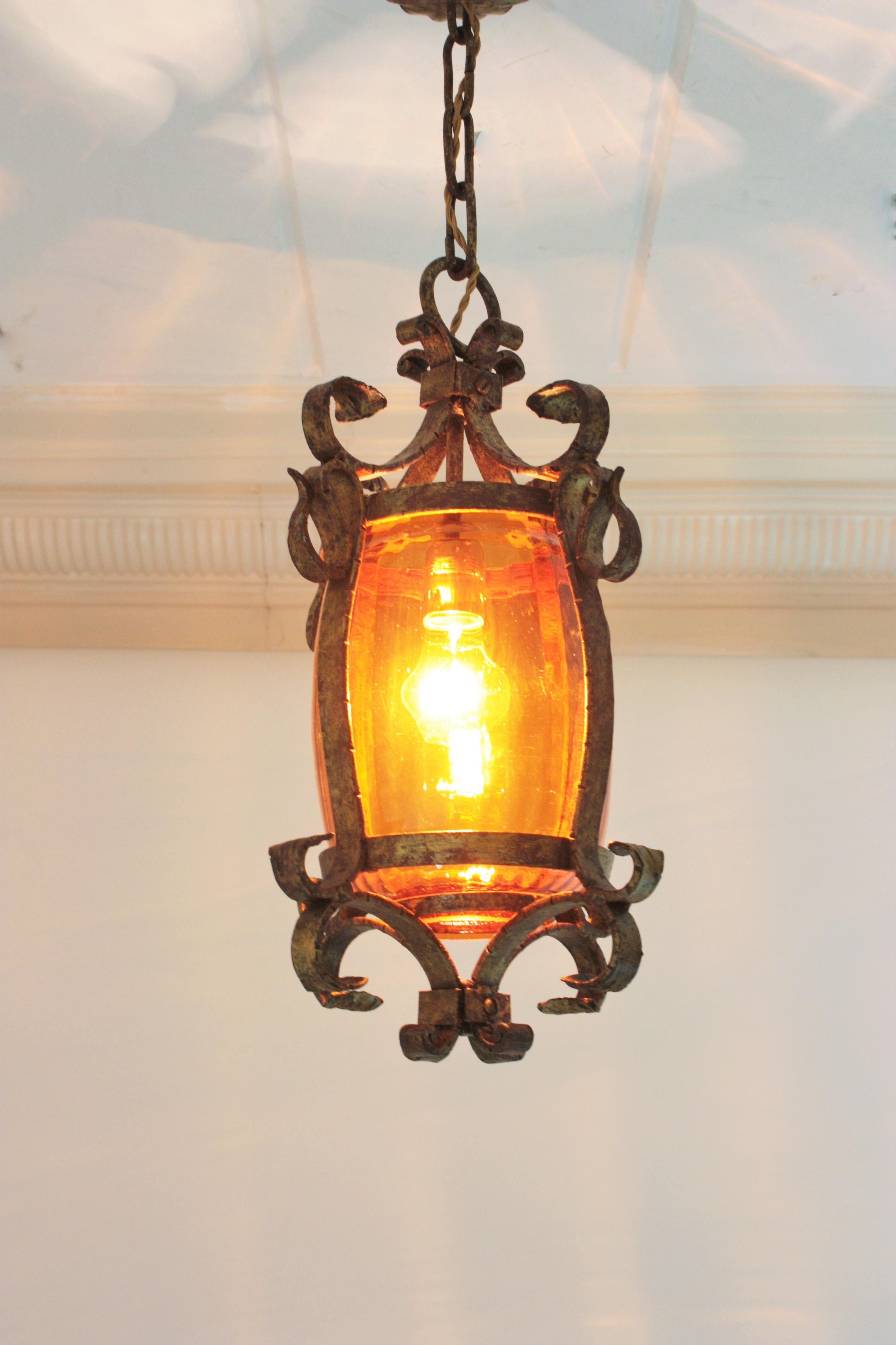 Chinoiserie Spanish Wrought Lantern or Pendant Lamp, Gilt Iron and Amber Glass, 1940s For Sale