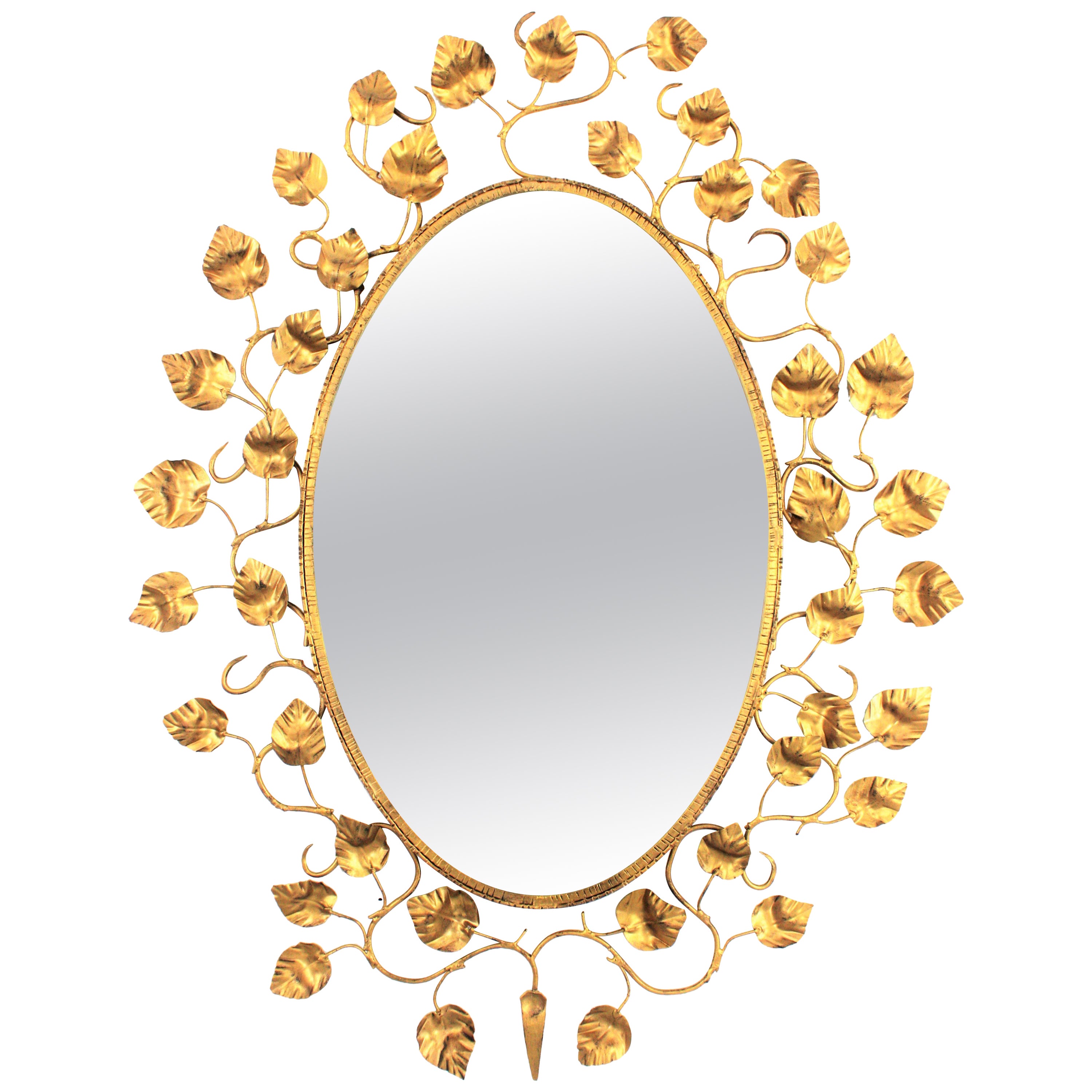Grand miroir ovale espagnol avec cadre en fer doré et feuillage, années 1950
