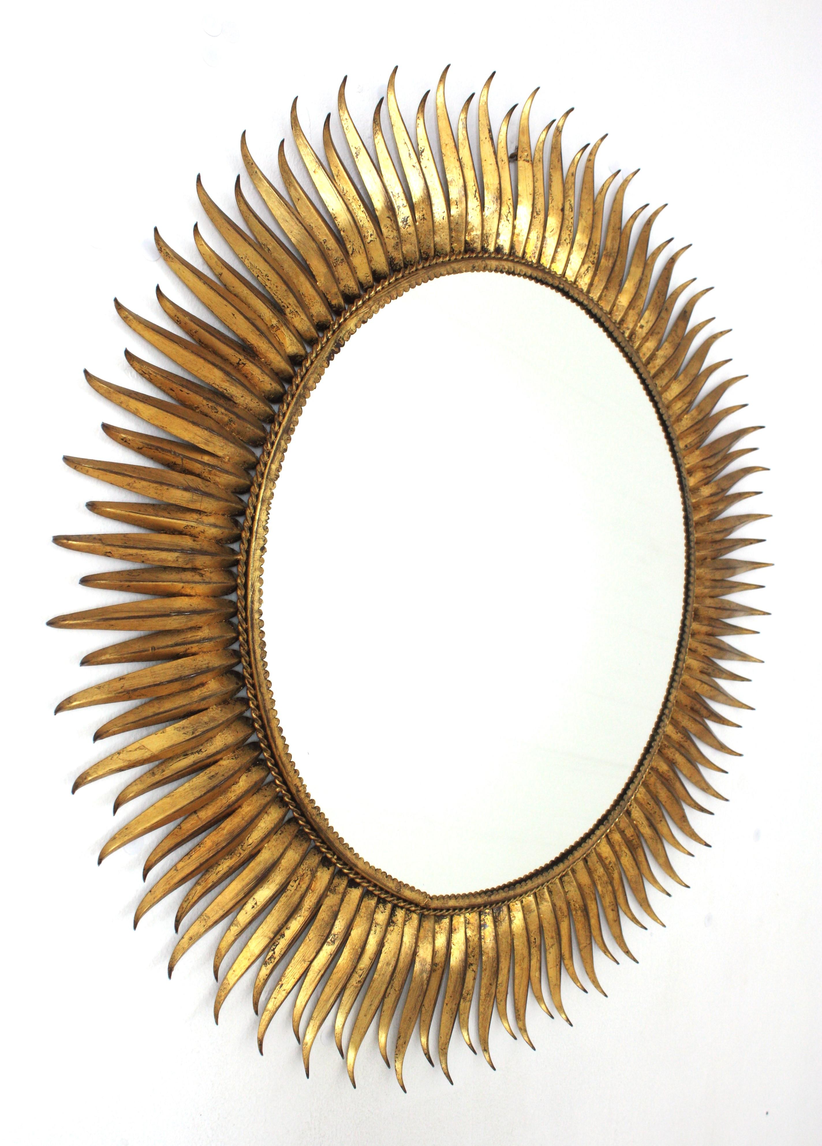 Brutalist Spanish Large Sunburst Eyelash Mirror in Gilt Wrought Iron For Sale