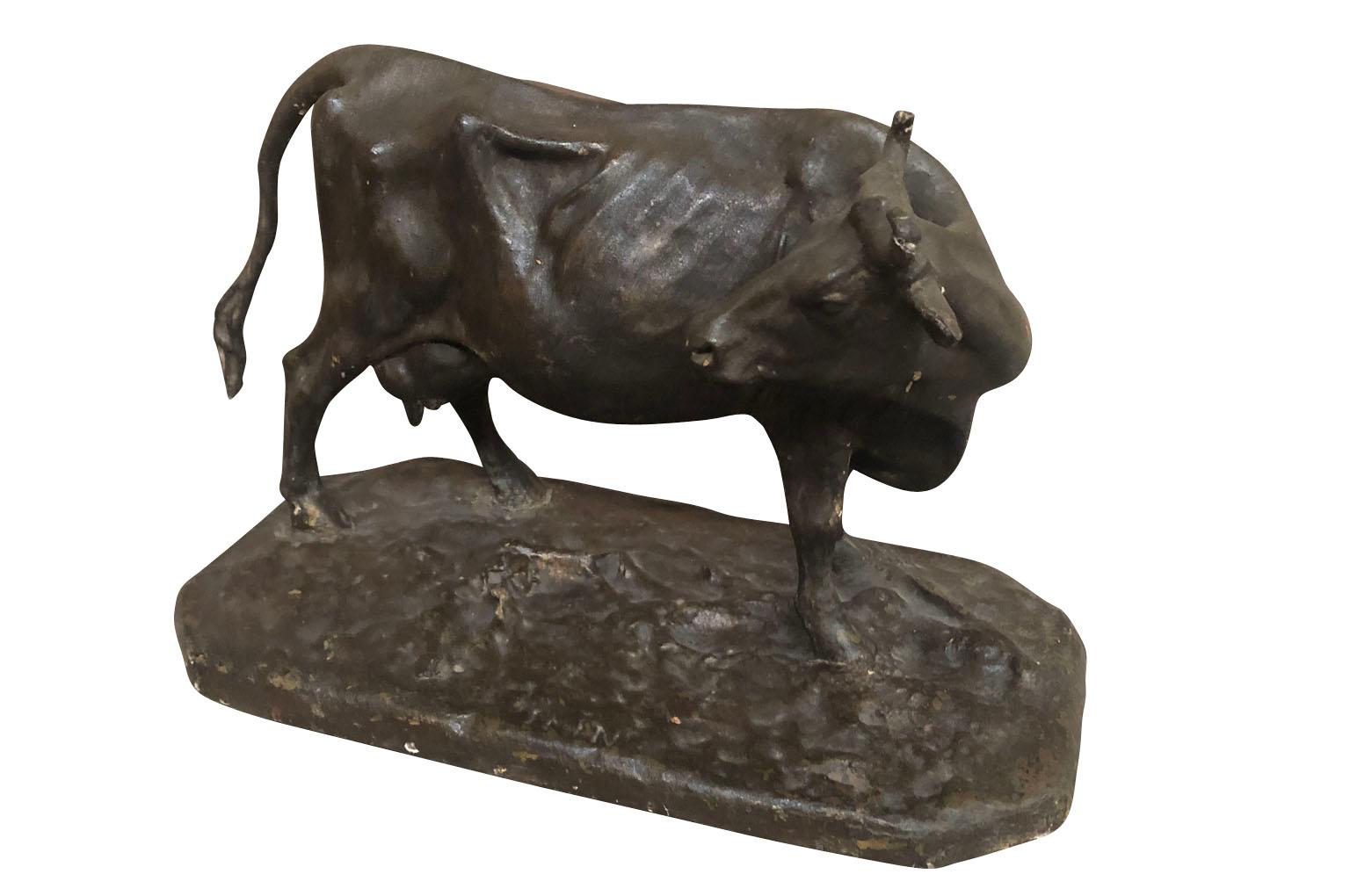 A very handsome later 19th century statue of a cow wonderfully constructed from papier mâché. A wonderful piece for any bookcase or table top.