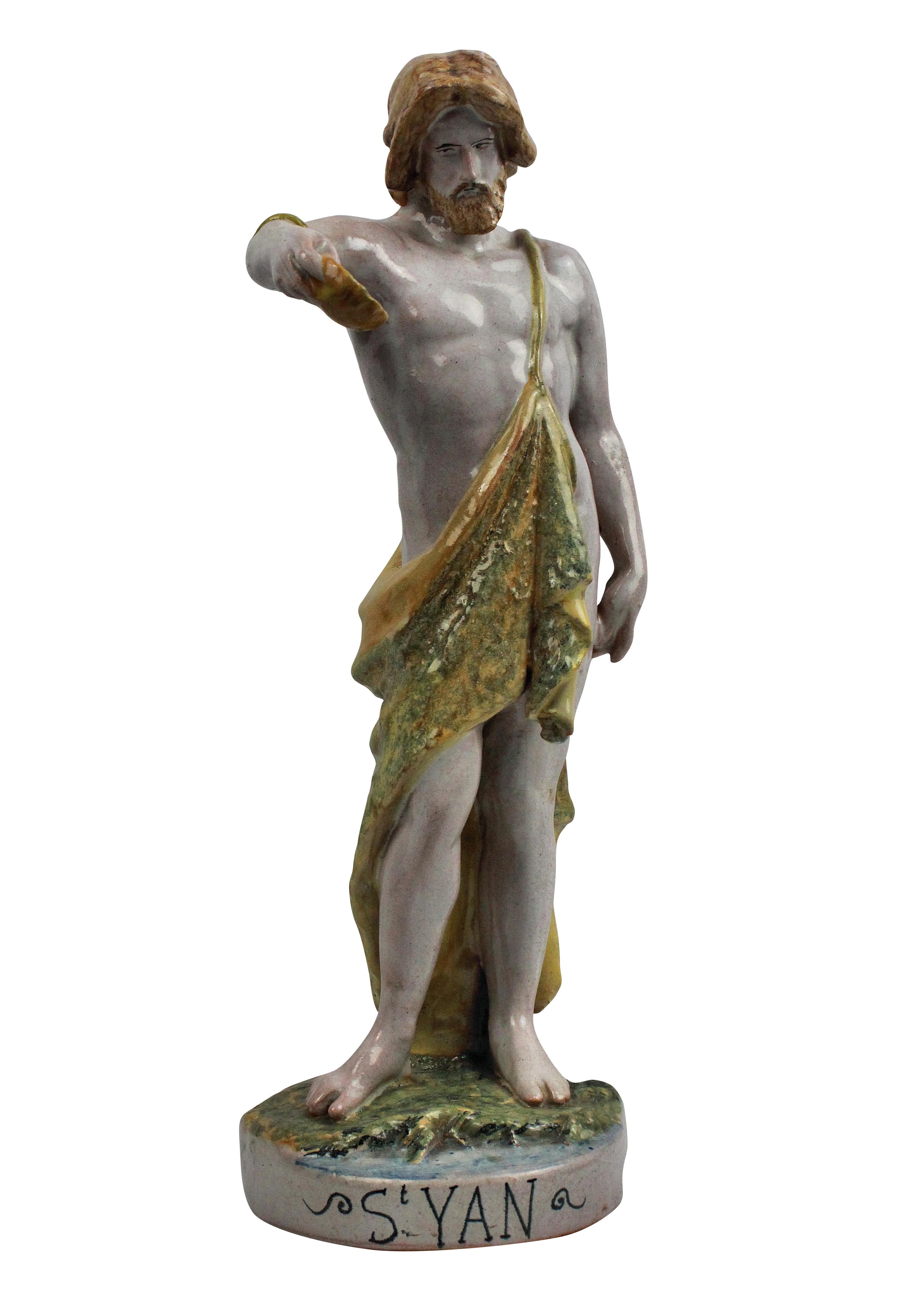 A Spanish (Catalan) tin glazed Majolica statue of St John the Baptist.