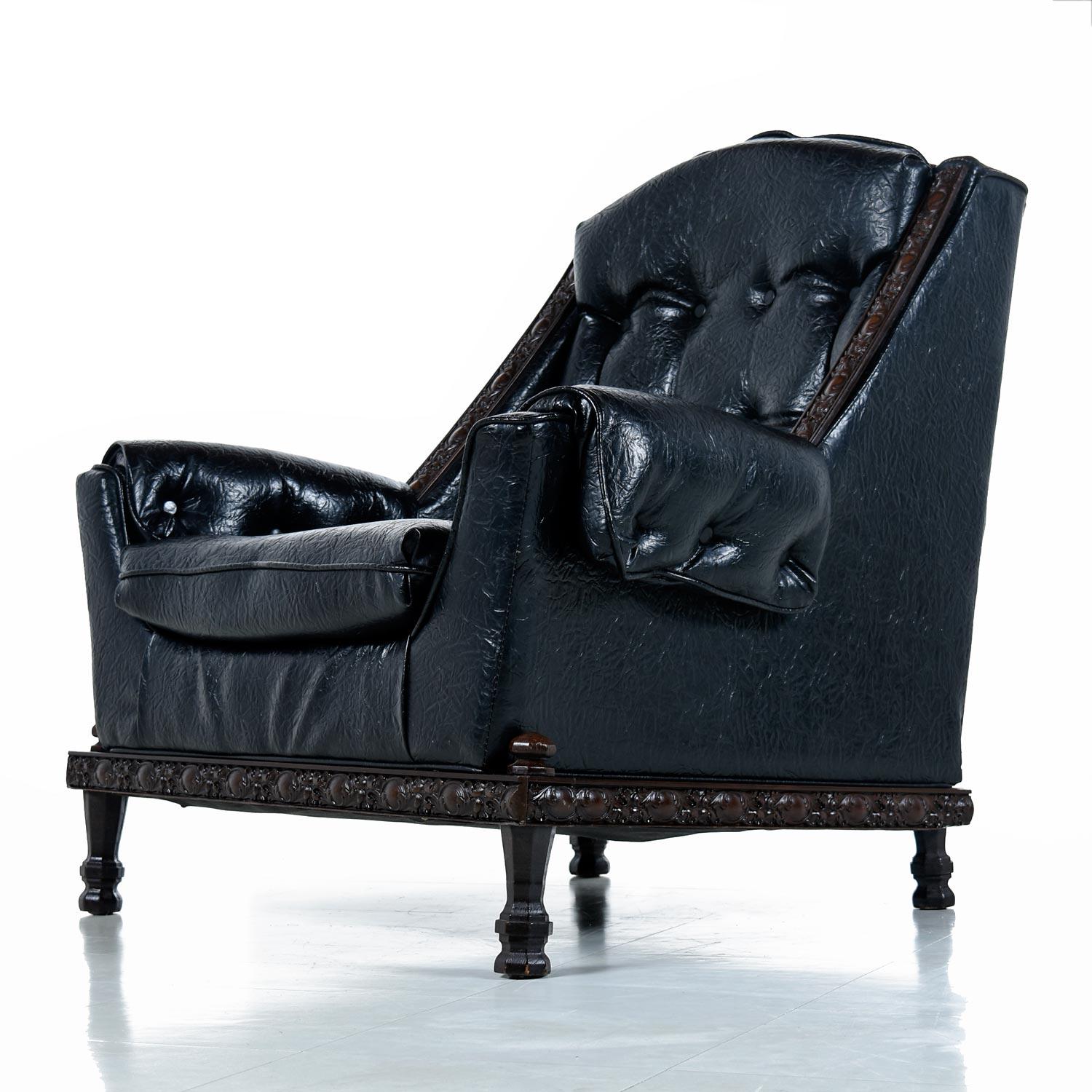 If you are looking for the perfect chair for your man cave, look no more. This thing oozes machismo with it’s original, heavily textured black vinyl upholstery and ornately carved solid wood trim. This handsome recliner isn’t all looks. The wide,