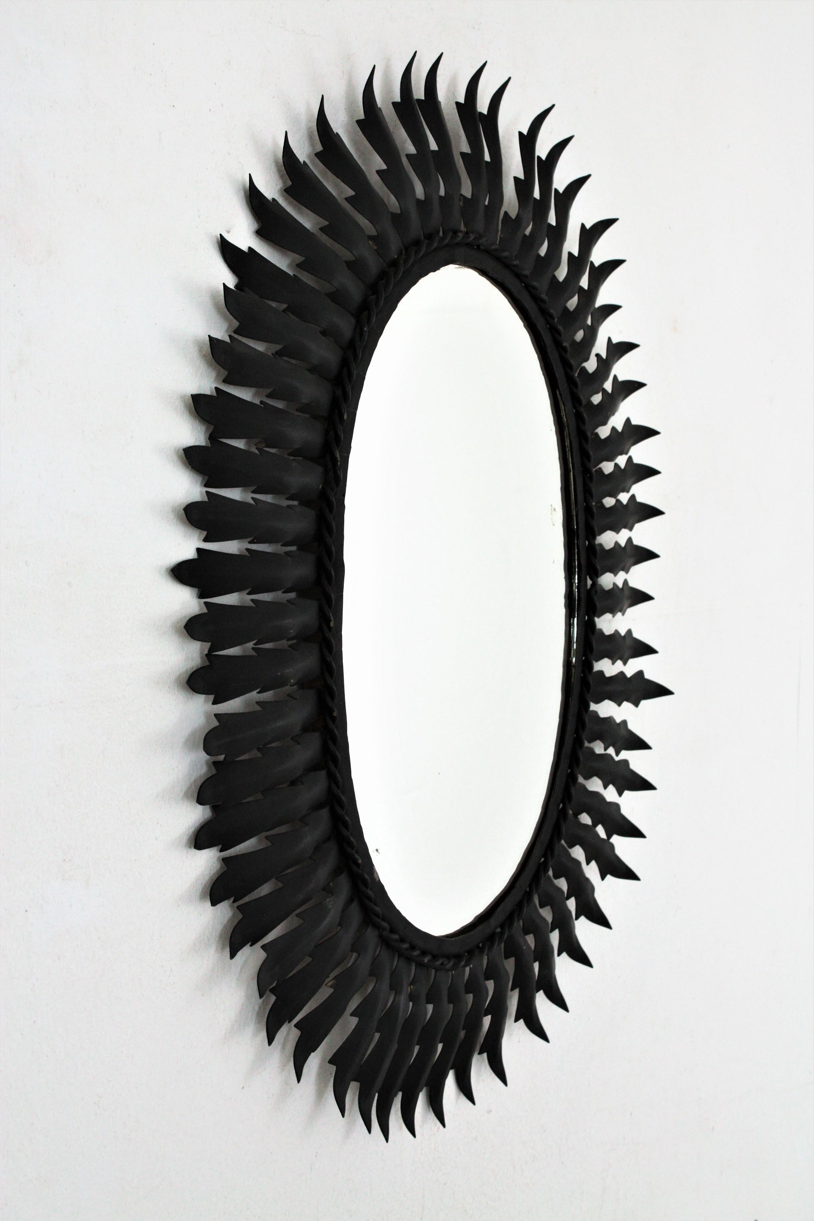 Spanish Metal Sunburst Oval Mirror Painted in Black, 1960s In Good Condition In Barcelona, ES